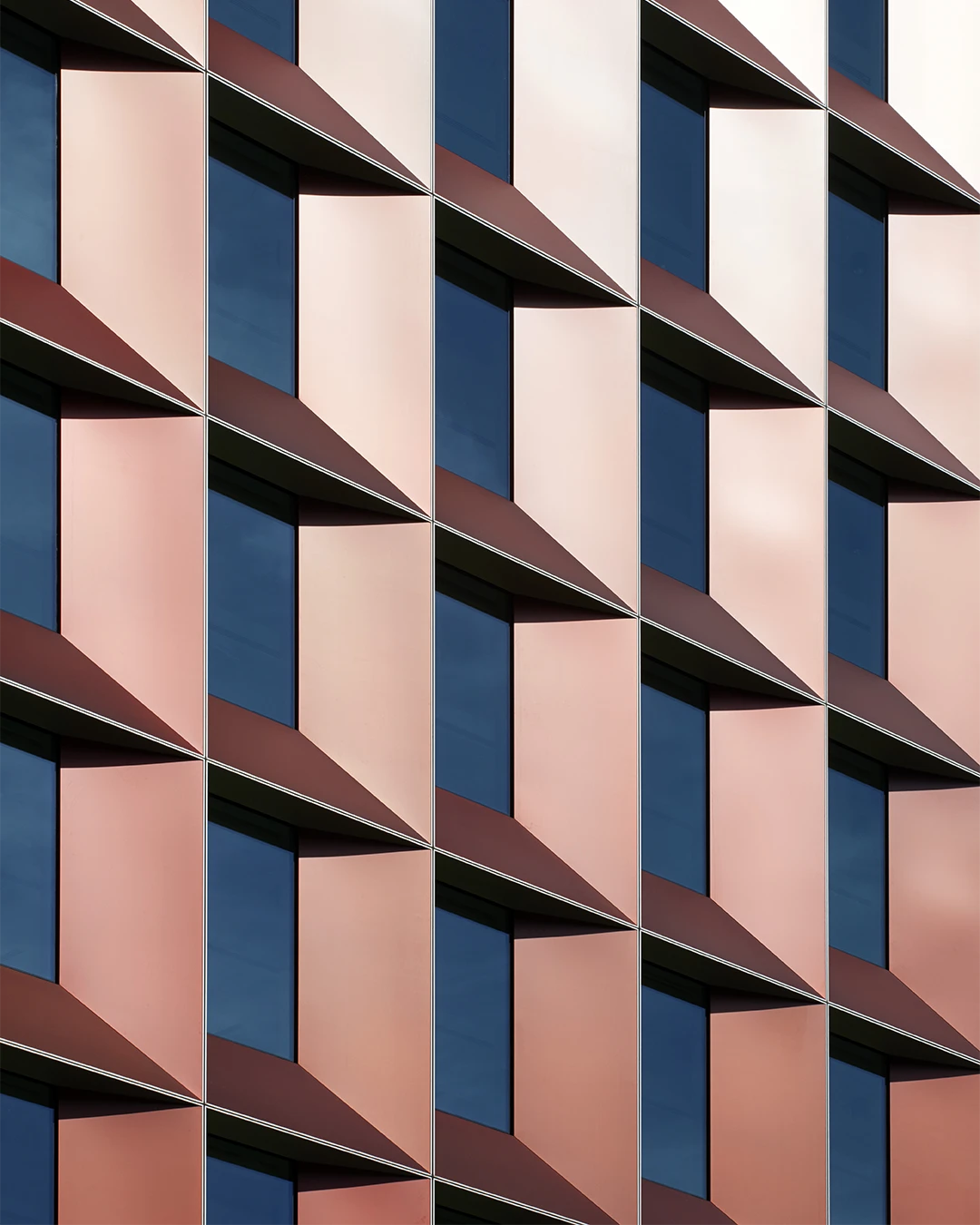 red angled anodised aluminium window surrounds