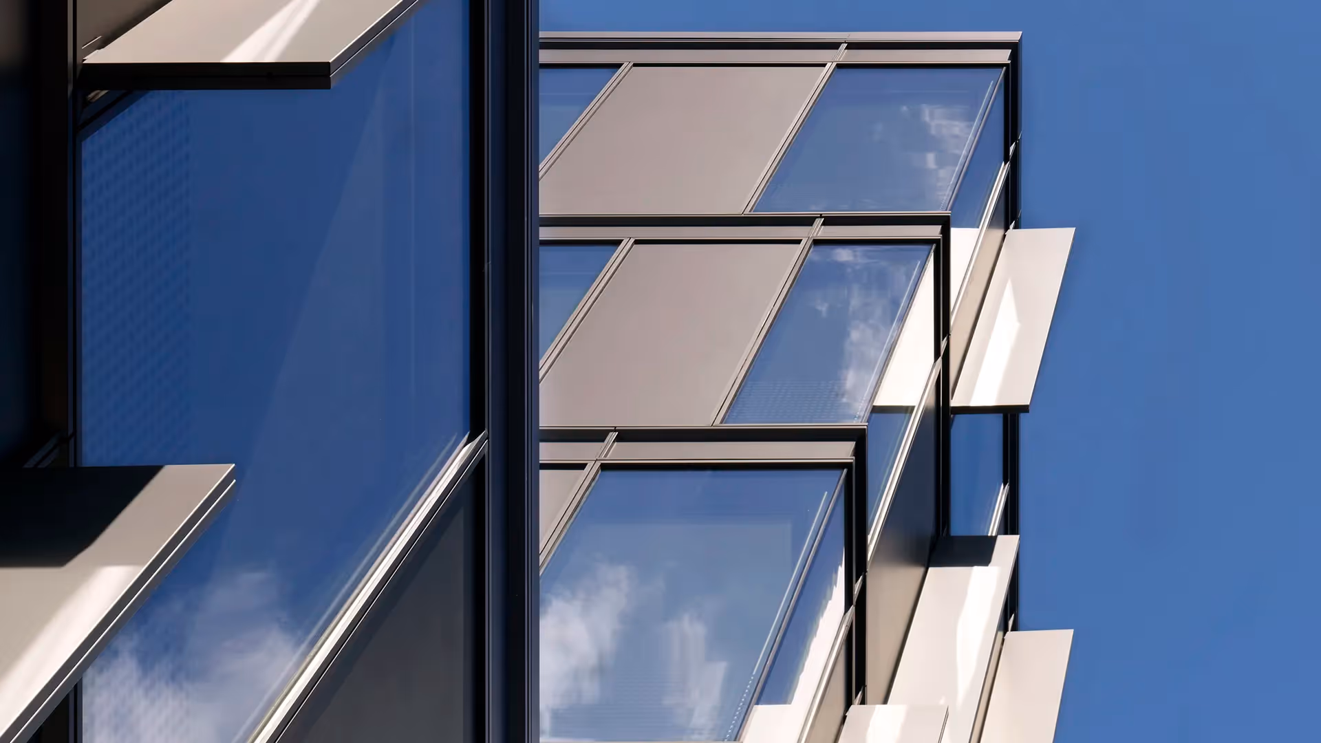 acade with blue grey anodised panels