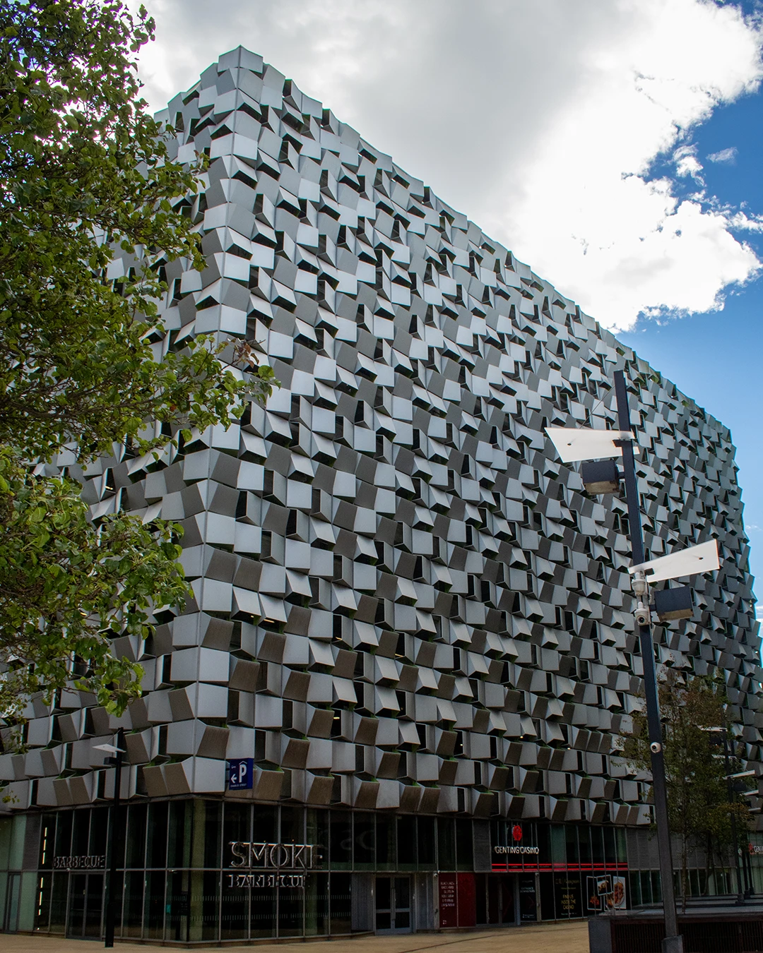 Full height of the Cheesegrater, Q-Park Charles Street, clad in anodised aluminium above its ground floor units