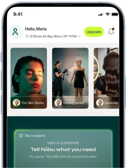 Mobile app interface showing a greeting to Maria, location selection, upgrade button, service cards for Skin Studio, Tanning center, and hairstylist, with a prompt to ask Niibu AI Concierge for help.