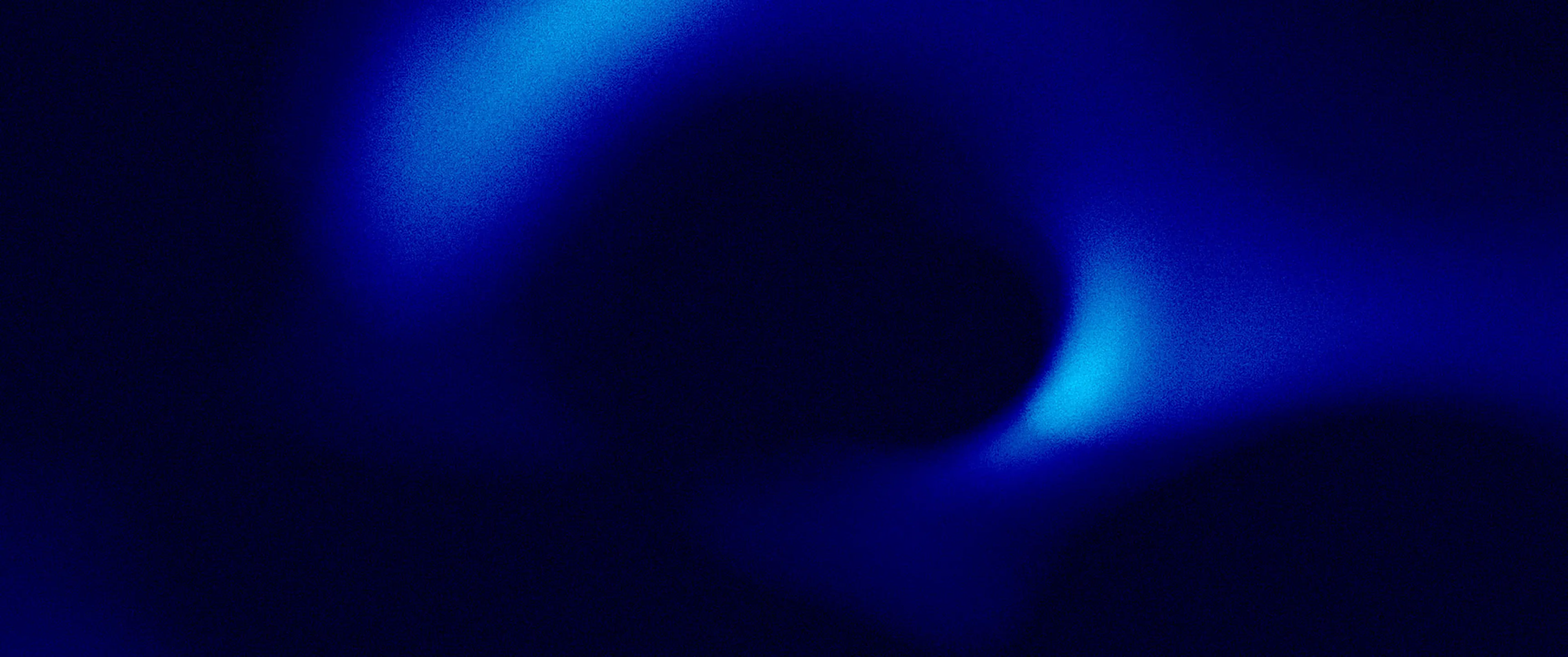 Halo lumineux bleu sur un fond sombre évoquant un phénomène lumineux abstrait.
