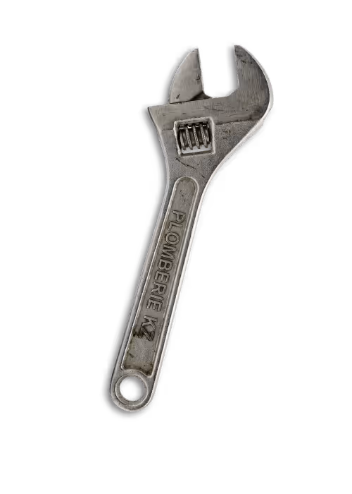 Adjustable metal wrench with the text 'PLOMBERIE KZ' engraved on the handle.