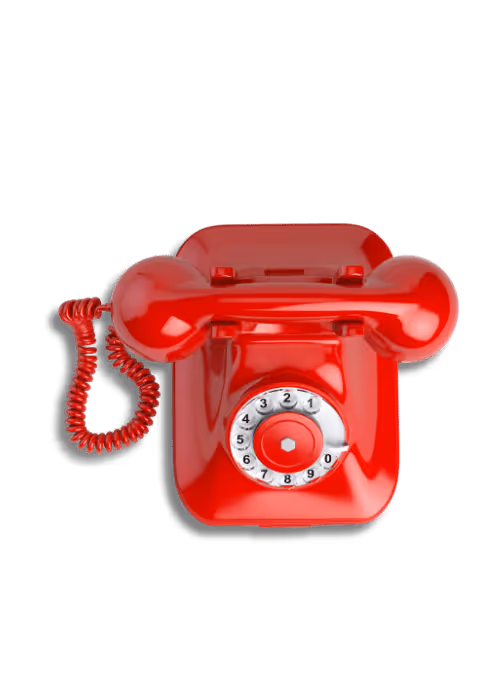 Glossy red vintage rotary dial telephone with coiled cord.