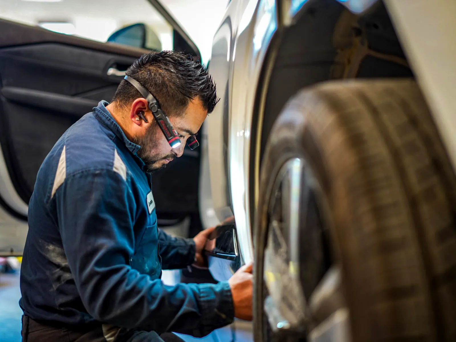 Amato's Auto Body estimator handling an insurance claim at his desk