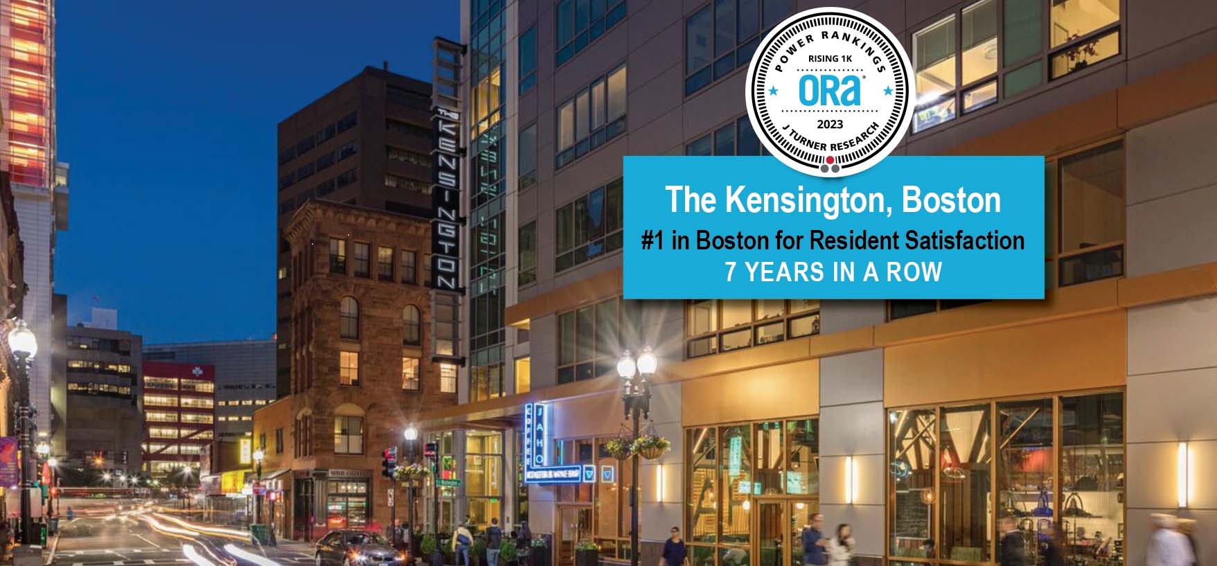Nighttime Boston skyline showcasing The Kensington property development, banner proclaiming #1 resident satisfaction 7 years in a row with ORA seals