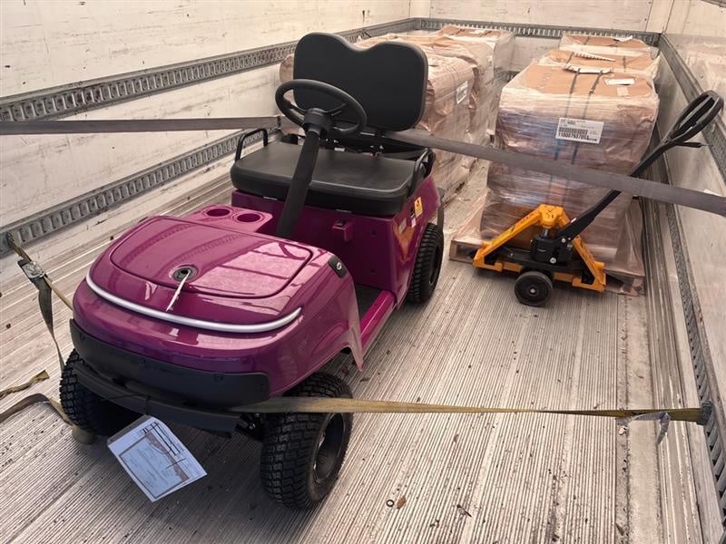 Golf cart strapped inside a liftgate box truck for dealer or residential delivery