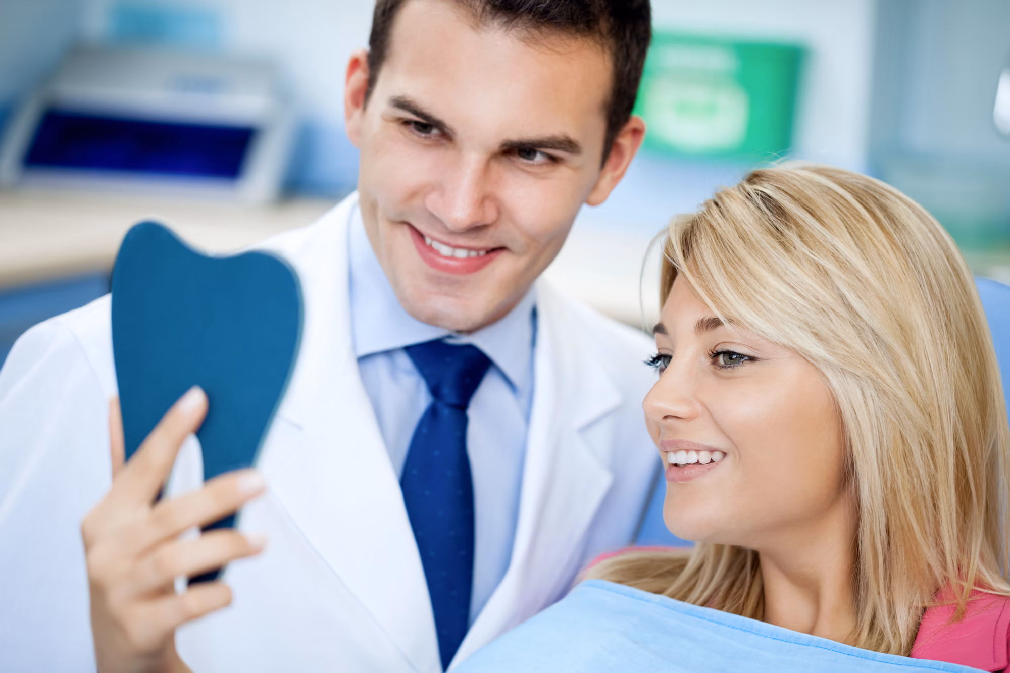 Patient receiving a cosmetic dental consultation in a clinical setting.