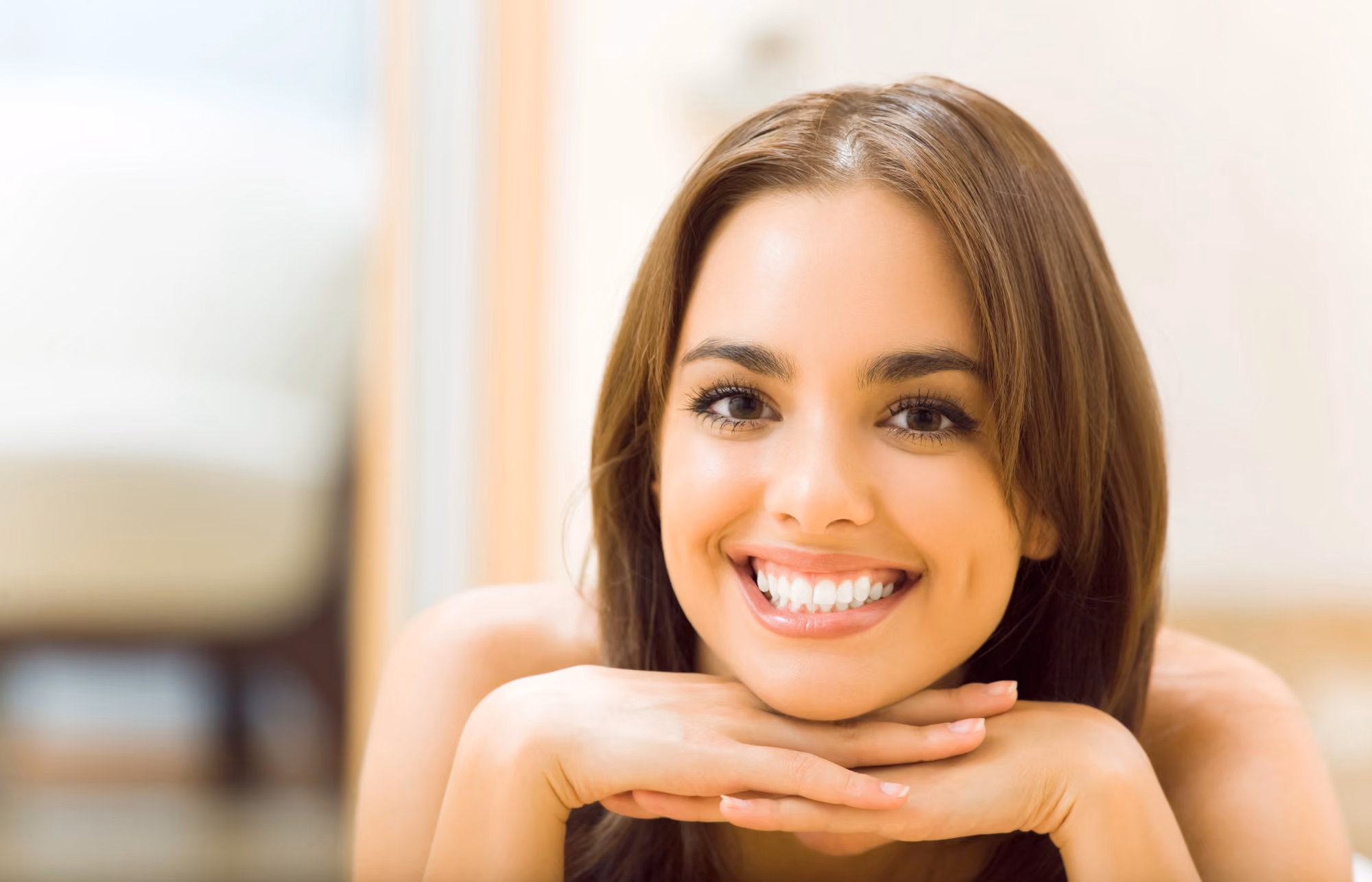Girl with a healthy smile featuring straight, white teeth.