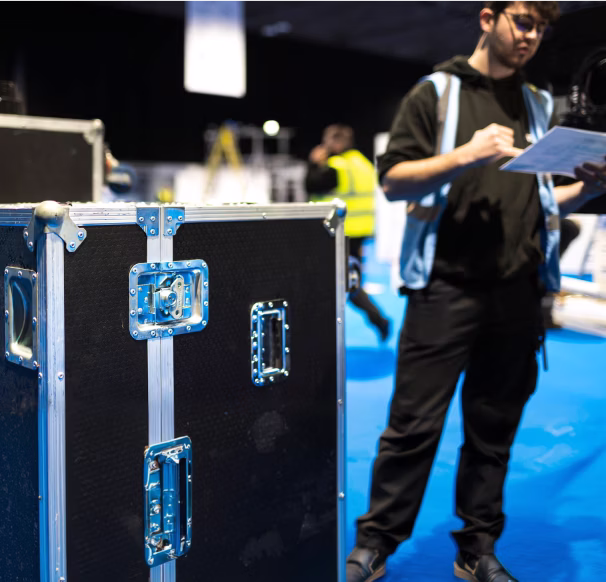 A Cameron Event Logistics employee working at an exhibition