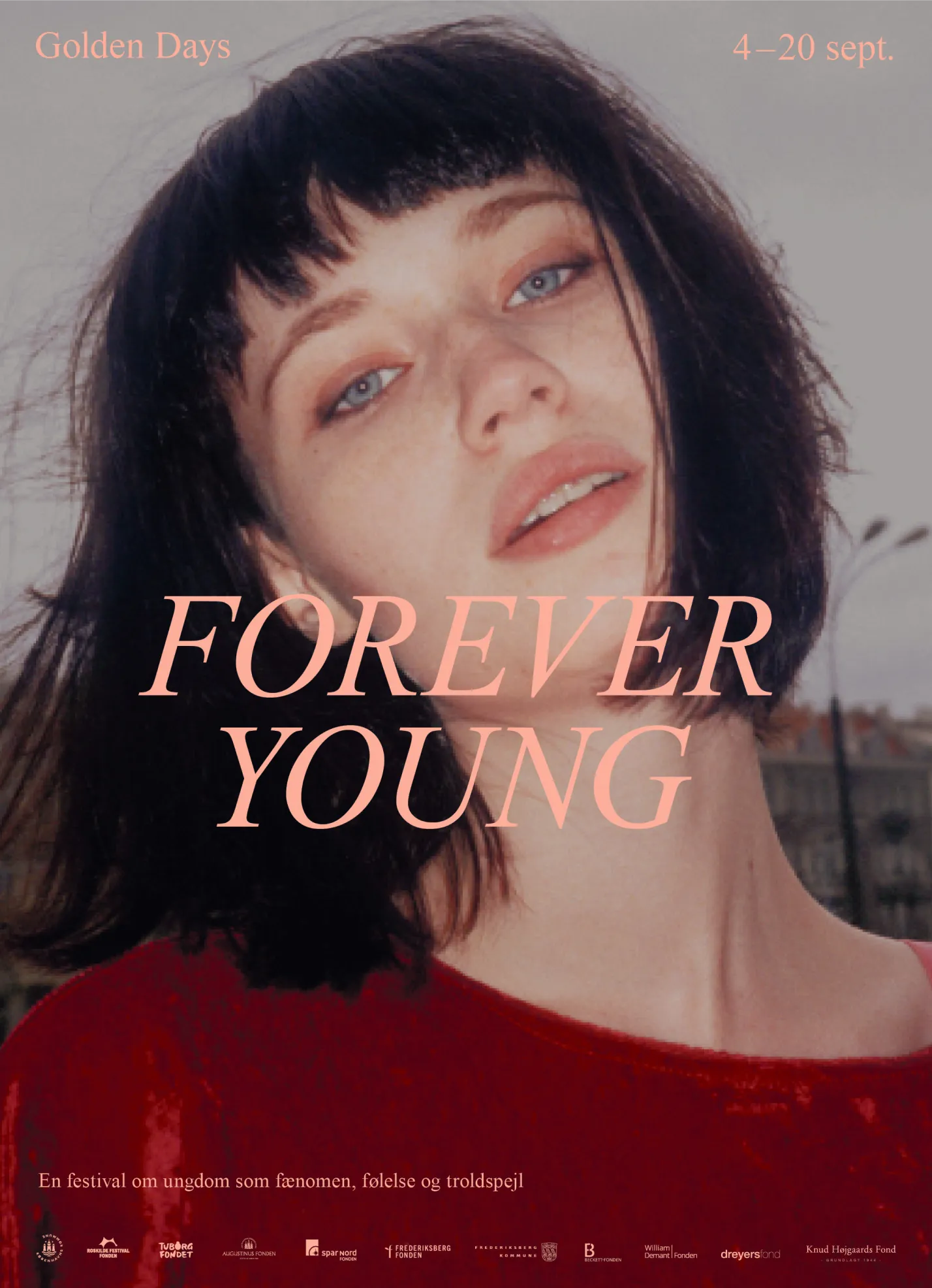 Close-up of a young woman with blue eyes and dark hair wearing a red top, with text 'FOREVER YOUNG' and event dates 4–20 Sept.