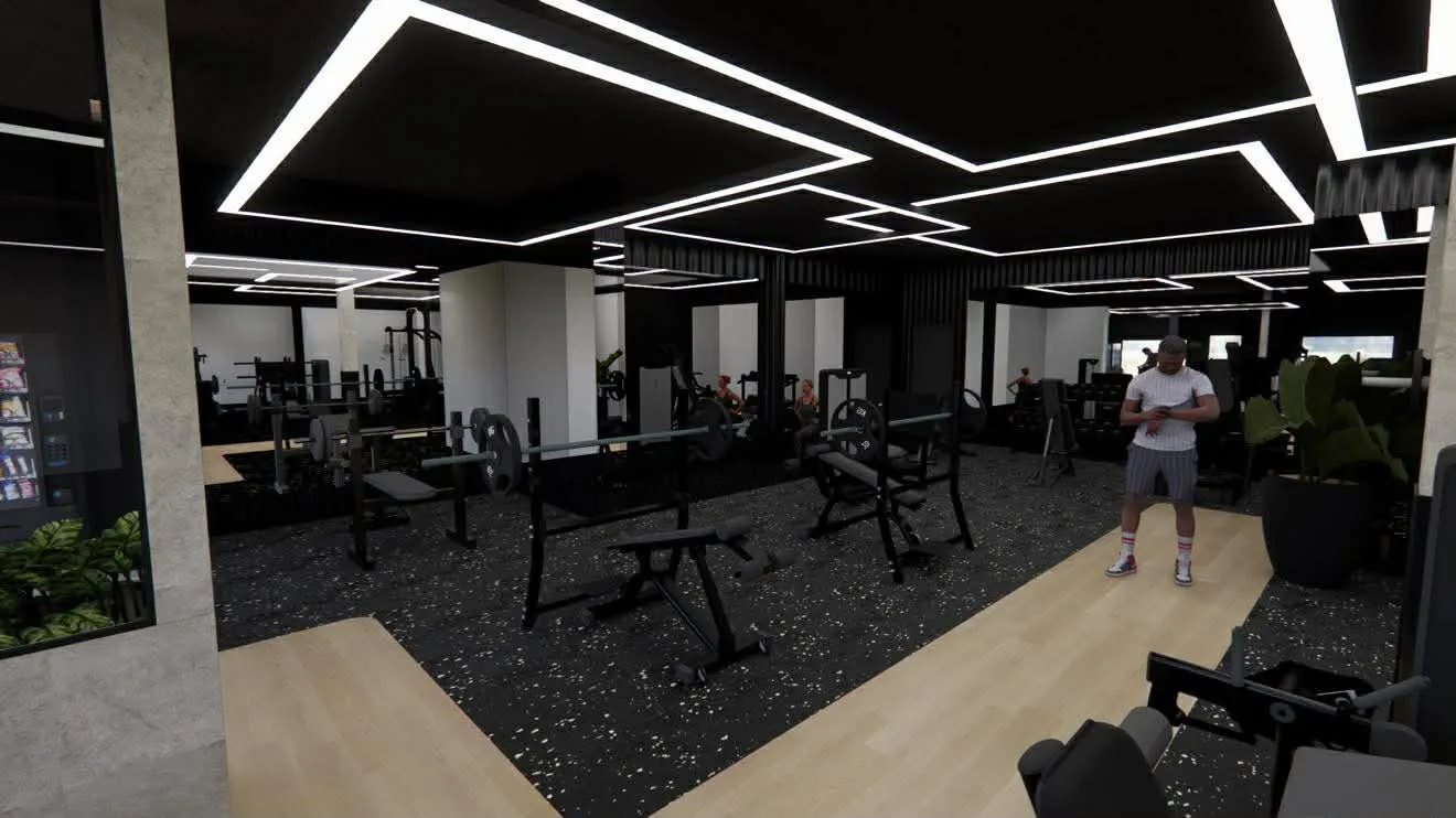 Intérieur moderne d'une salle de gym avec équipements de musculation et une personne en tenue sportive consultant une montre.