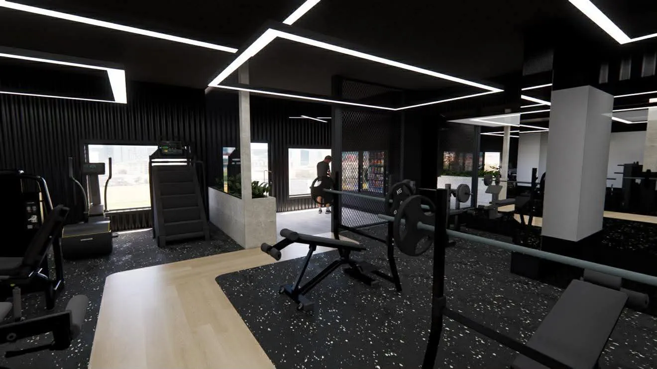 Salle de gym moderne avec équipement de musculation, tapis de course, et un utilisateur près d'une fontaine à eau.