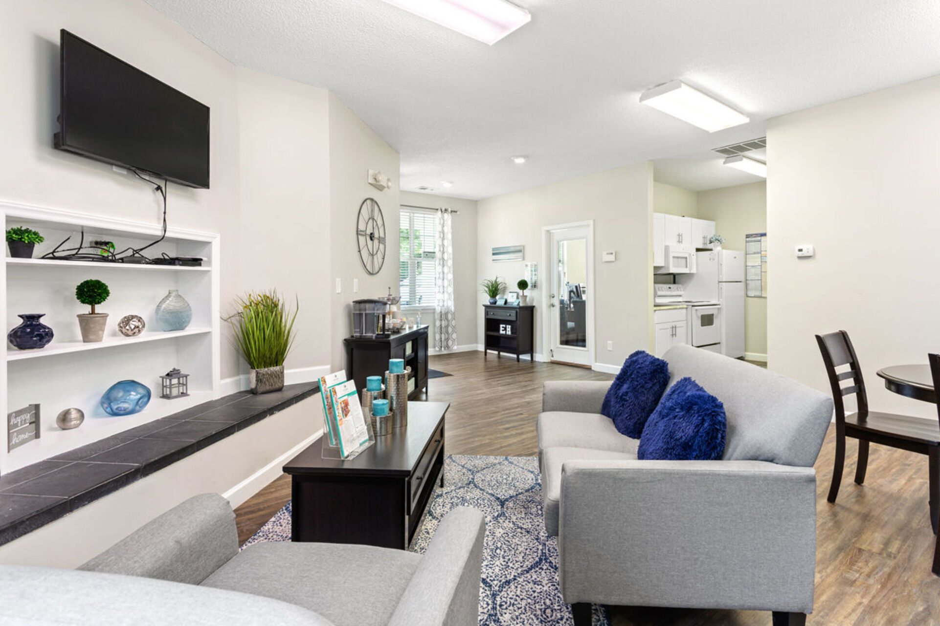 Clubhouse lounge with sofa, coffee table, and tv