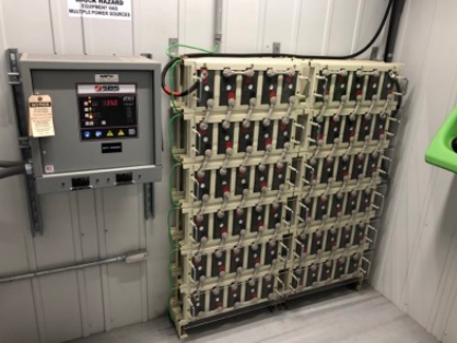 image of a technician installing solar panels