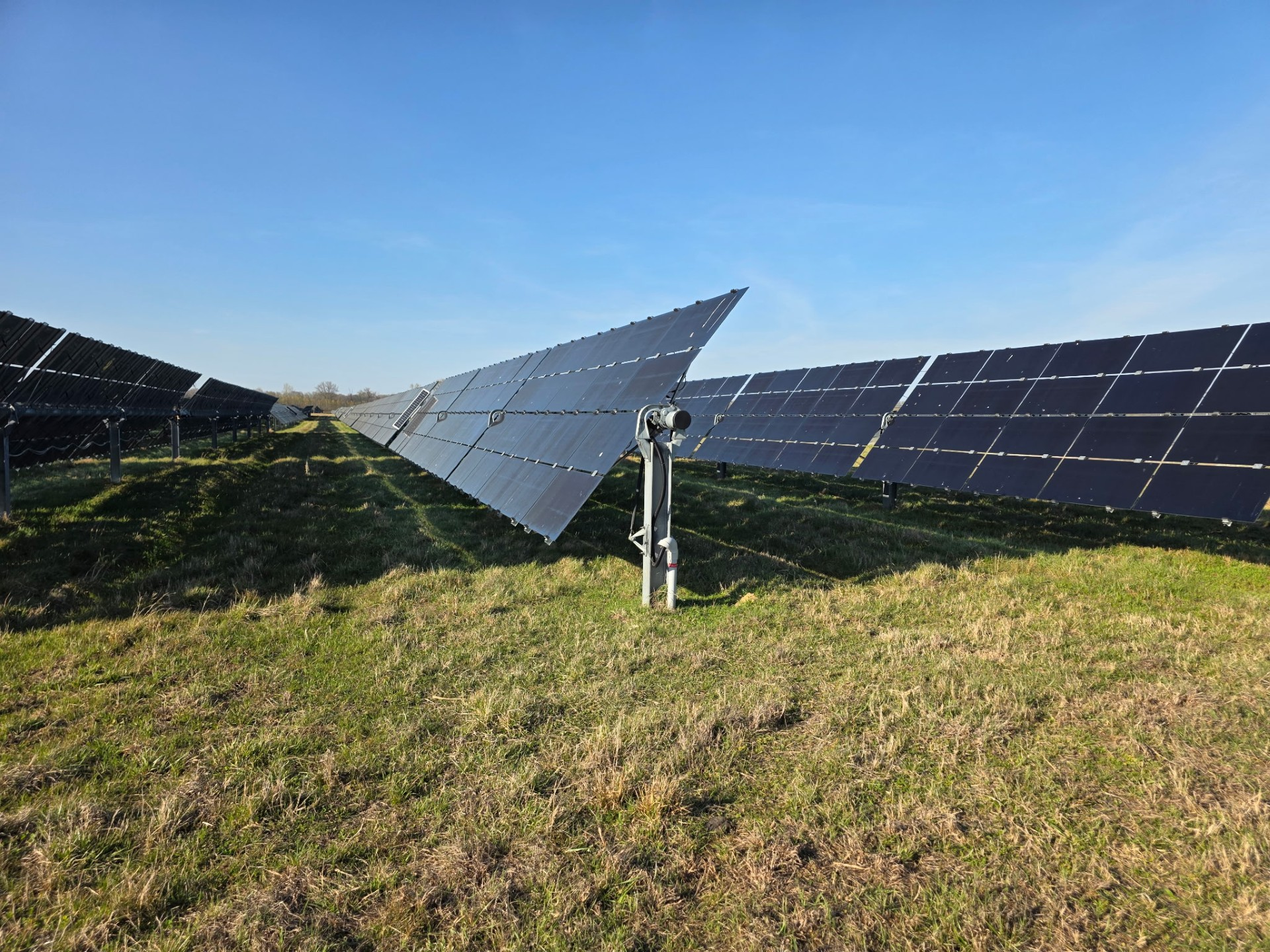 image of a technician installing solar panels