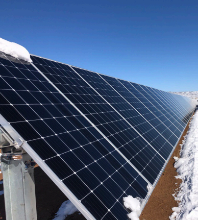 image of a technician installing solar panels