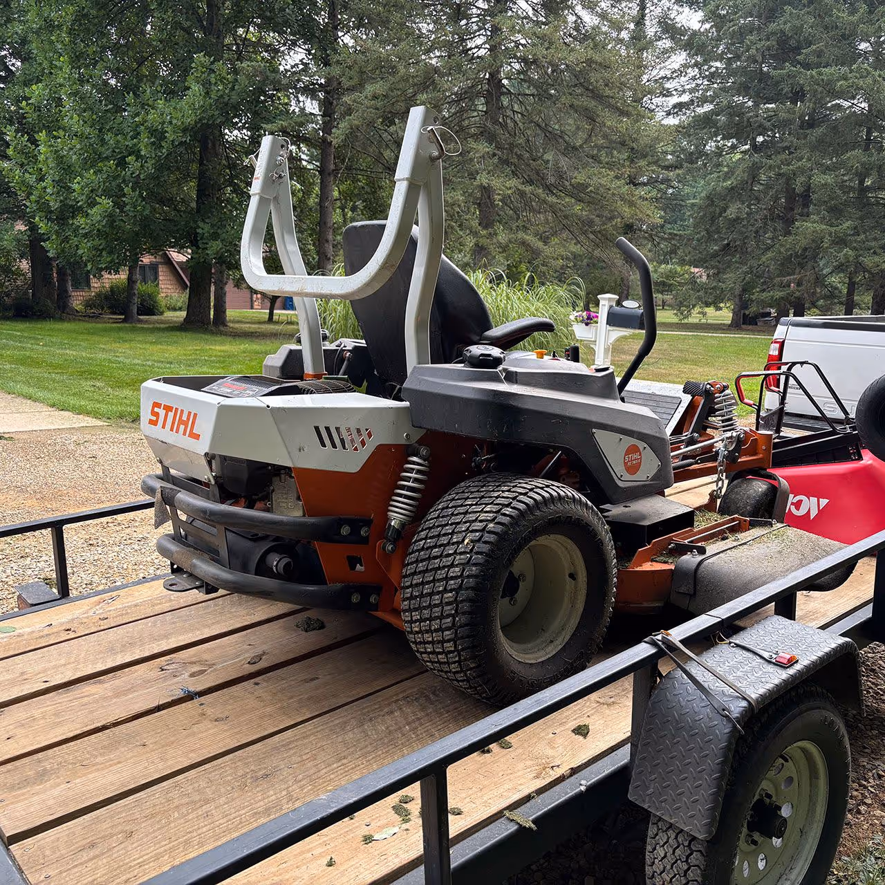 Commercial landscaping equipment and trailer setup