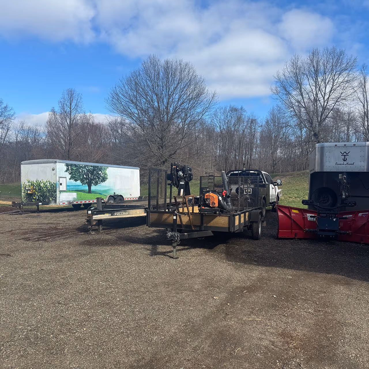 Skid steer and equipment used for grading and landscaping