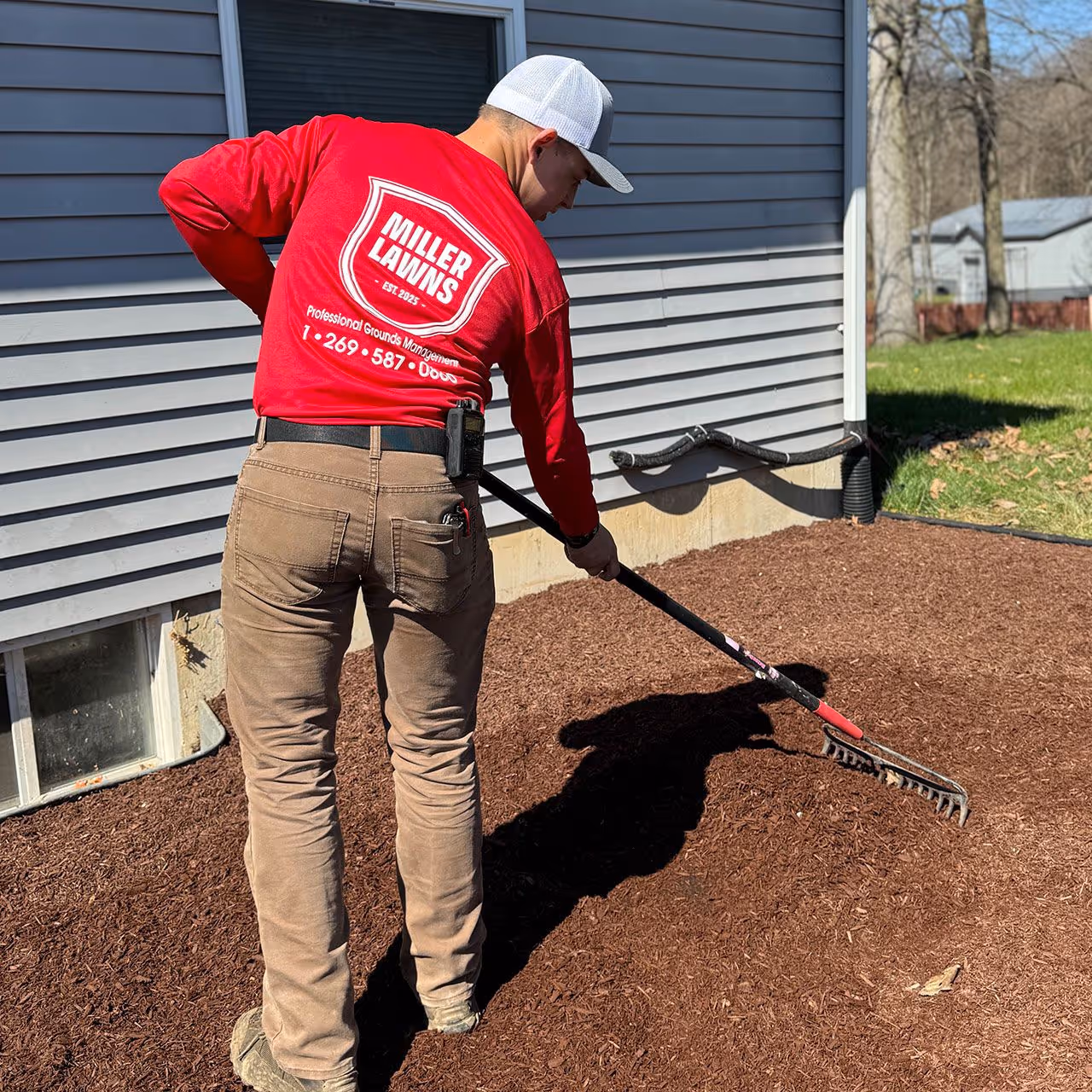Miller Lawns LLC crew performing site grading and excavation for a hardscaping project in Southwest Michigan