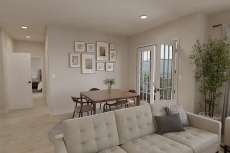 Rendering of a 2-bedroom living and dining area with a tufted sofa, wood dining table, and French doors to the balcony