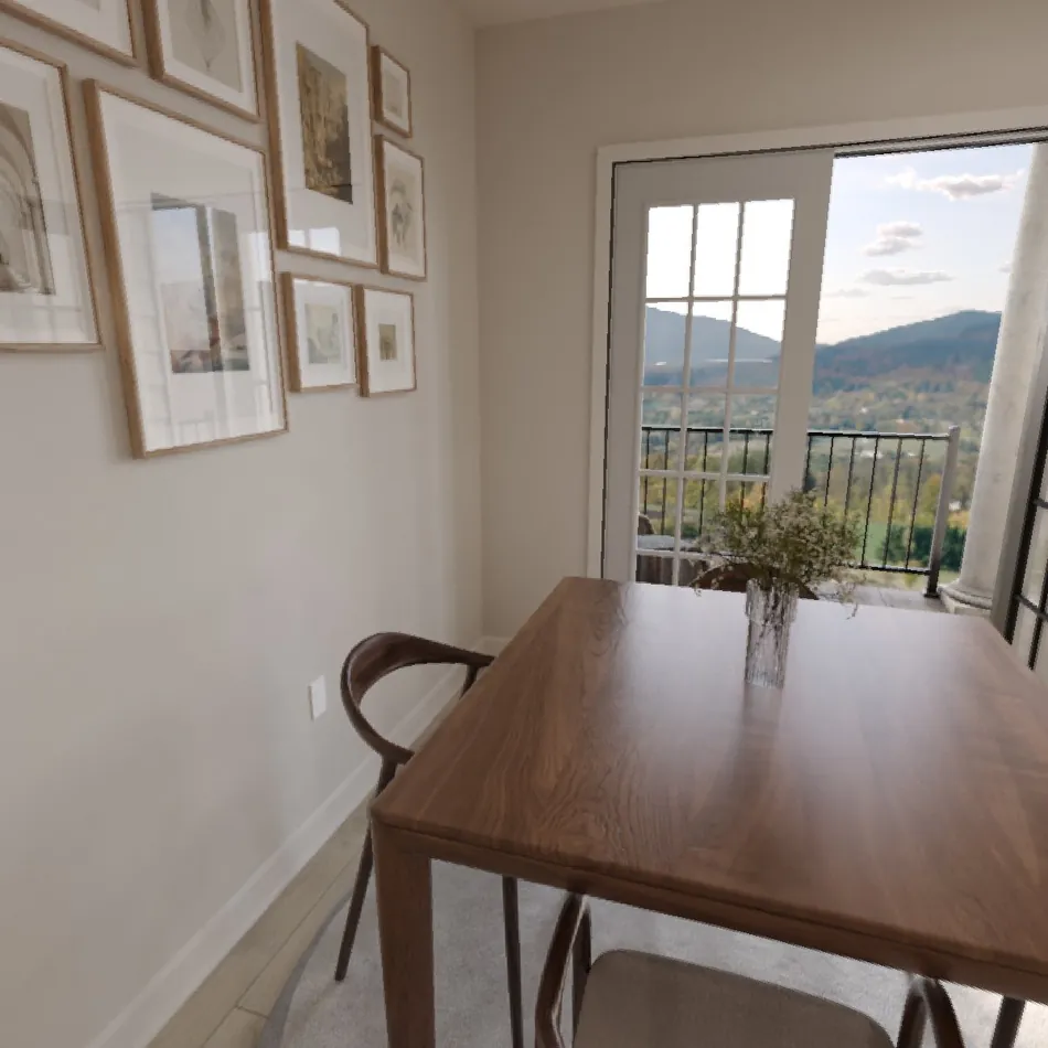 Rendering of a 2-bedroom dining area with a wood table beside balcony doors overlooking the mountains
