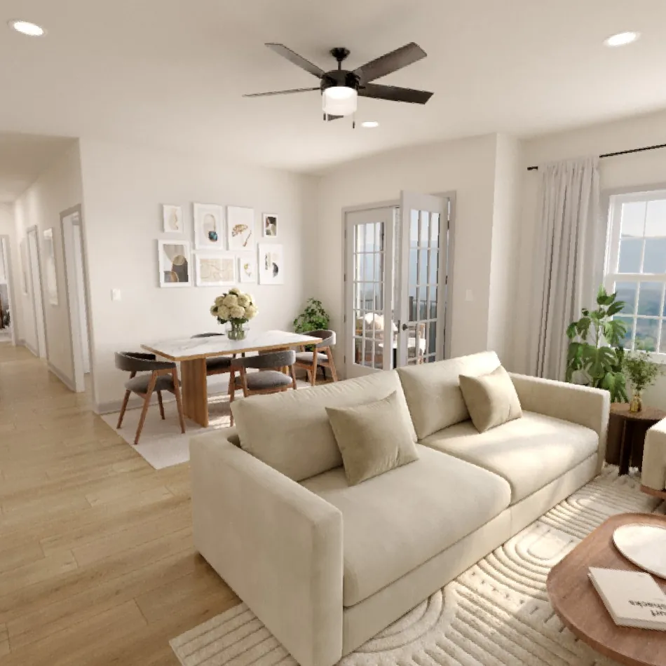 Rendering of a 3-bedroom living room with a cream sofa, dining area, and windows with mountain views