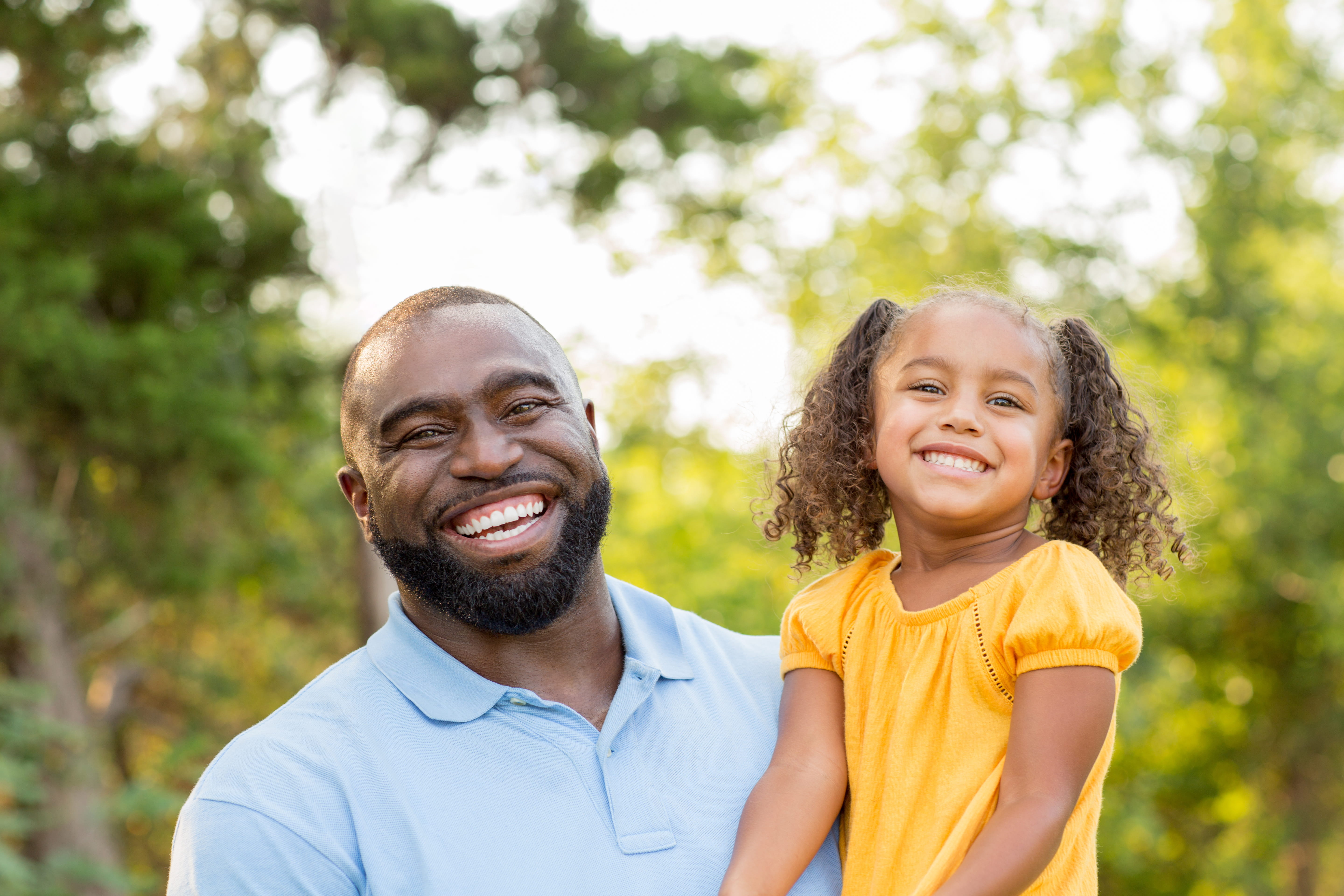 Dad and daughter smiling stock image