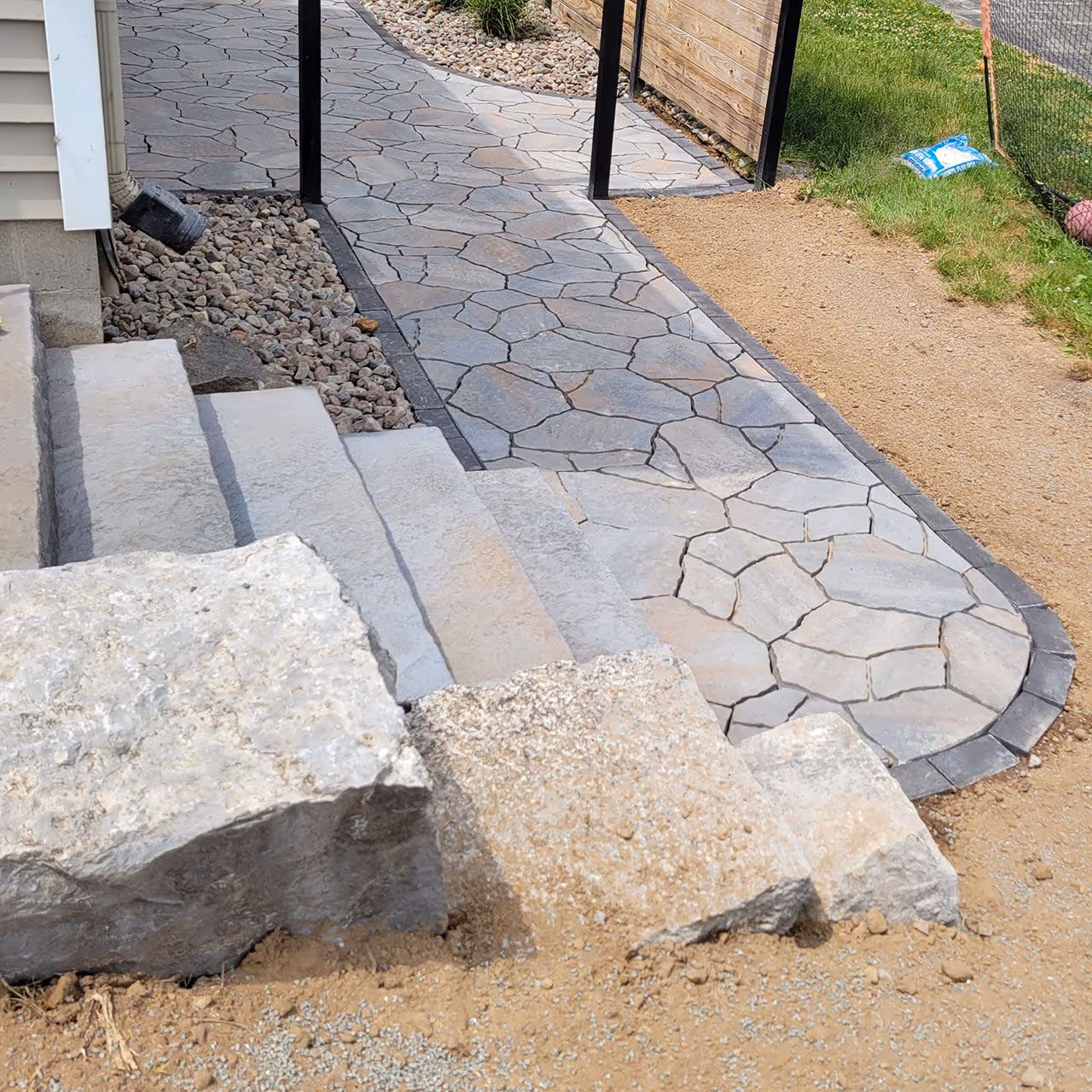 paver steps installation with retaining wall landscaping design