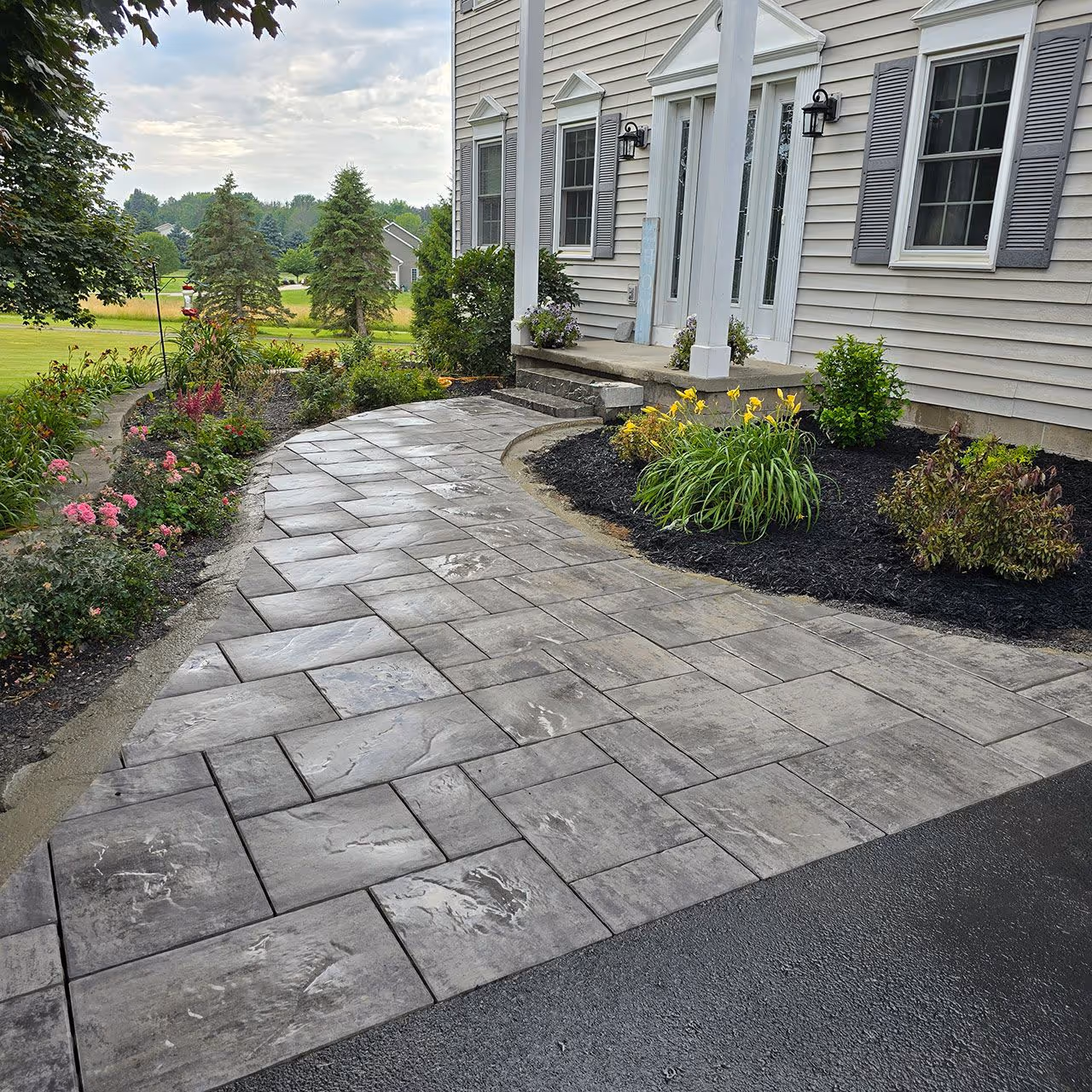 backyard hardscape design with patio and walkway features