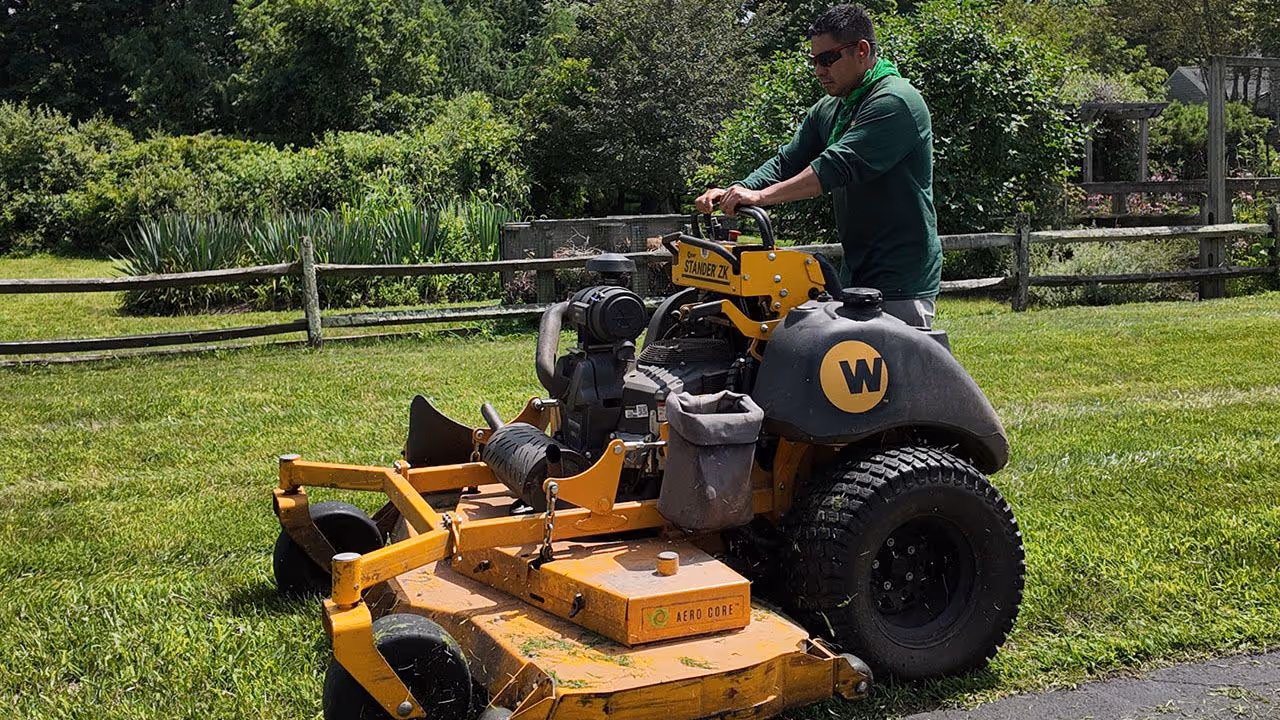 Lawn mowing and maintenance services near me by Adriano Landscaping