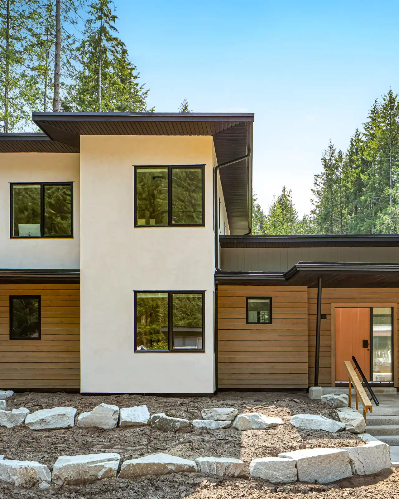 Facet Custom Builders - completed custom home twilight exterior home renovation management