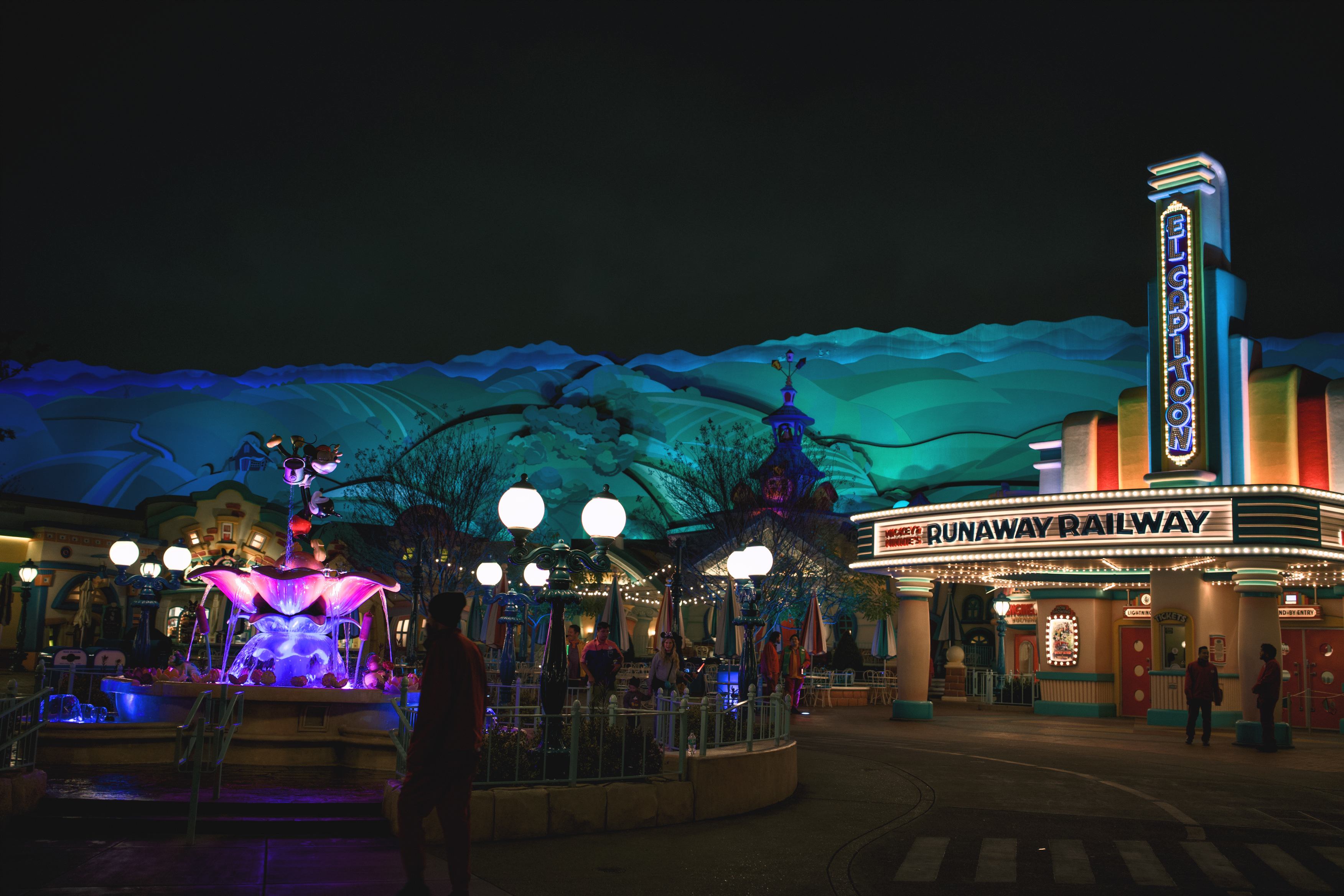 Theme park lifestyle photography at night with illuminated rides by Danx Design