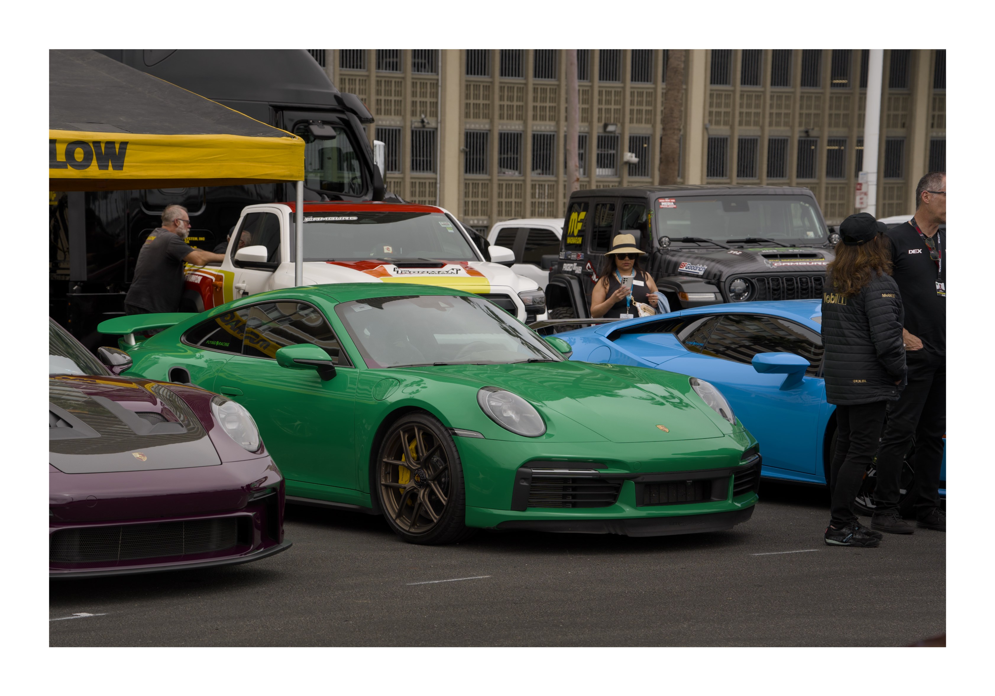 Colorful exotic cars at a lifestyle automotive event by Danx Design