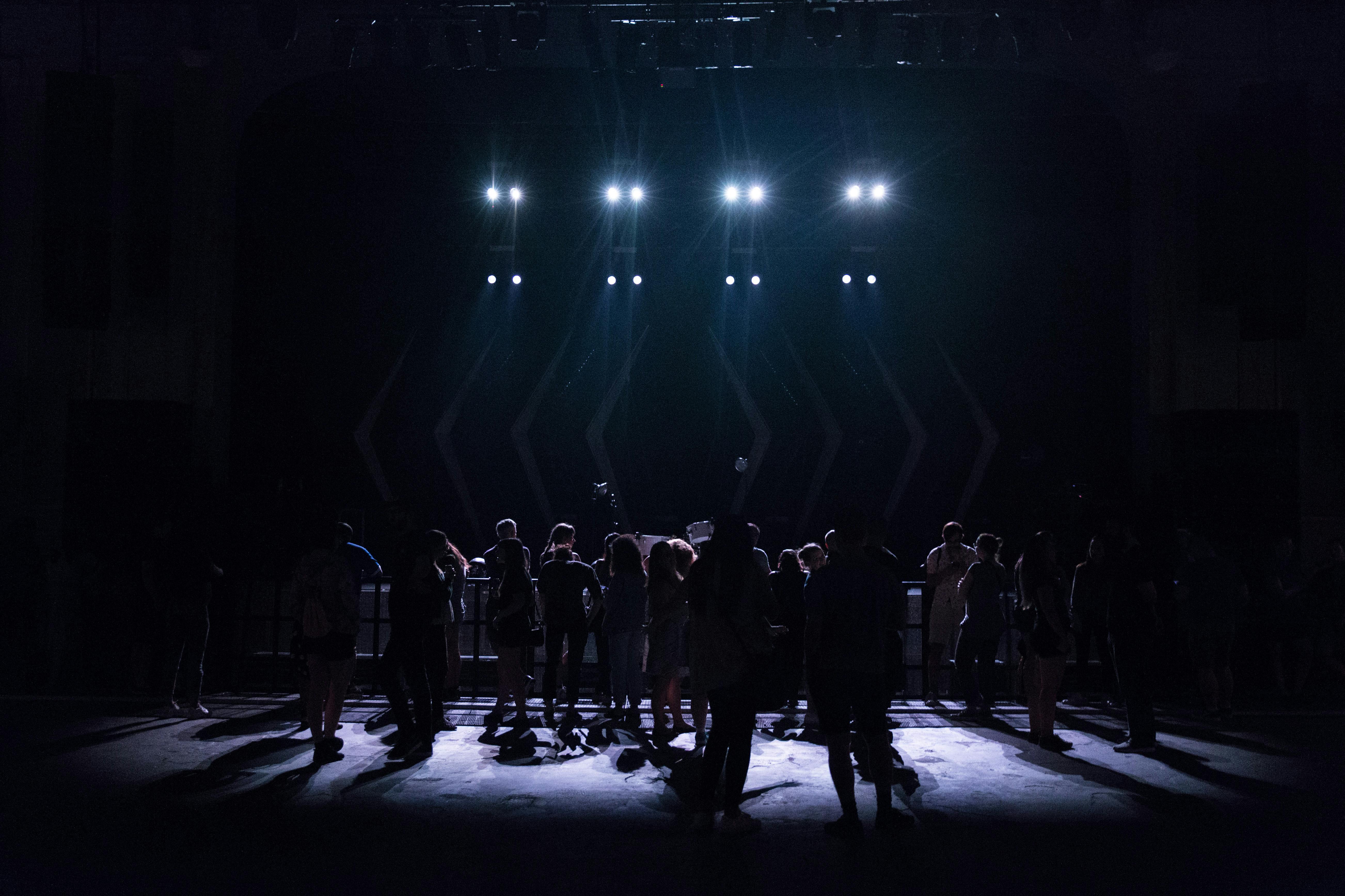A cast in dramatic spotlight