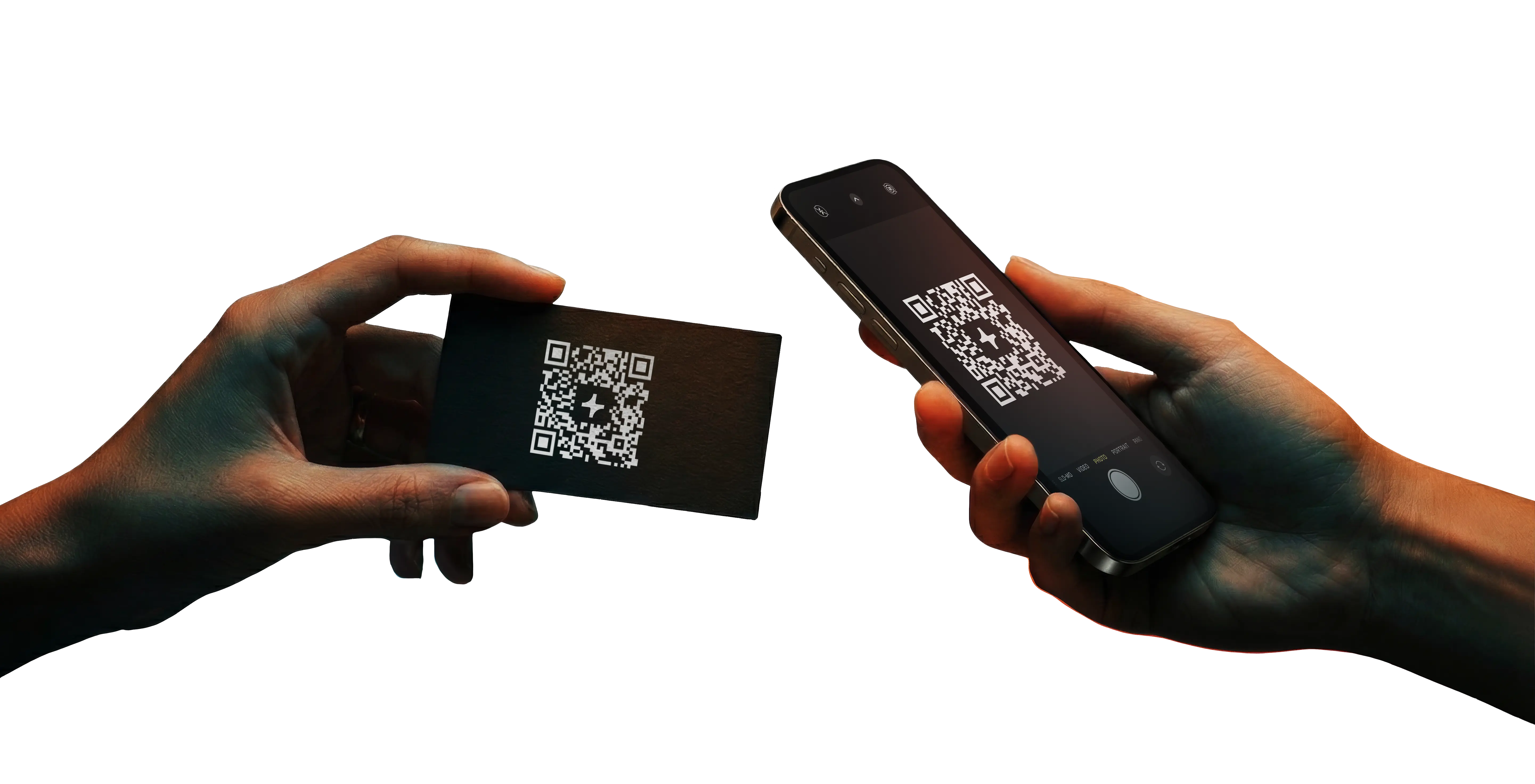 Hand holding a smartphone scanning a QR code on a black card held by another hand.