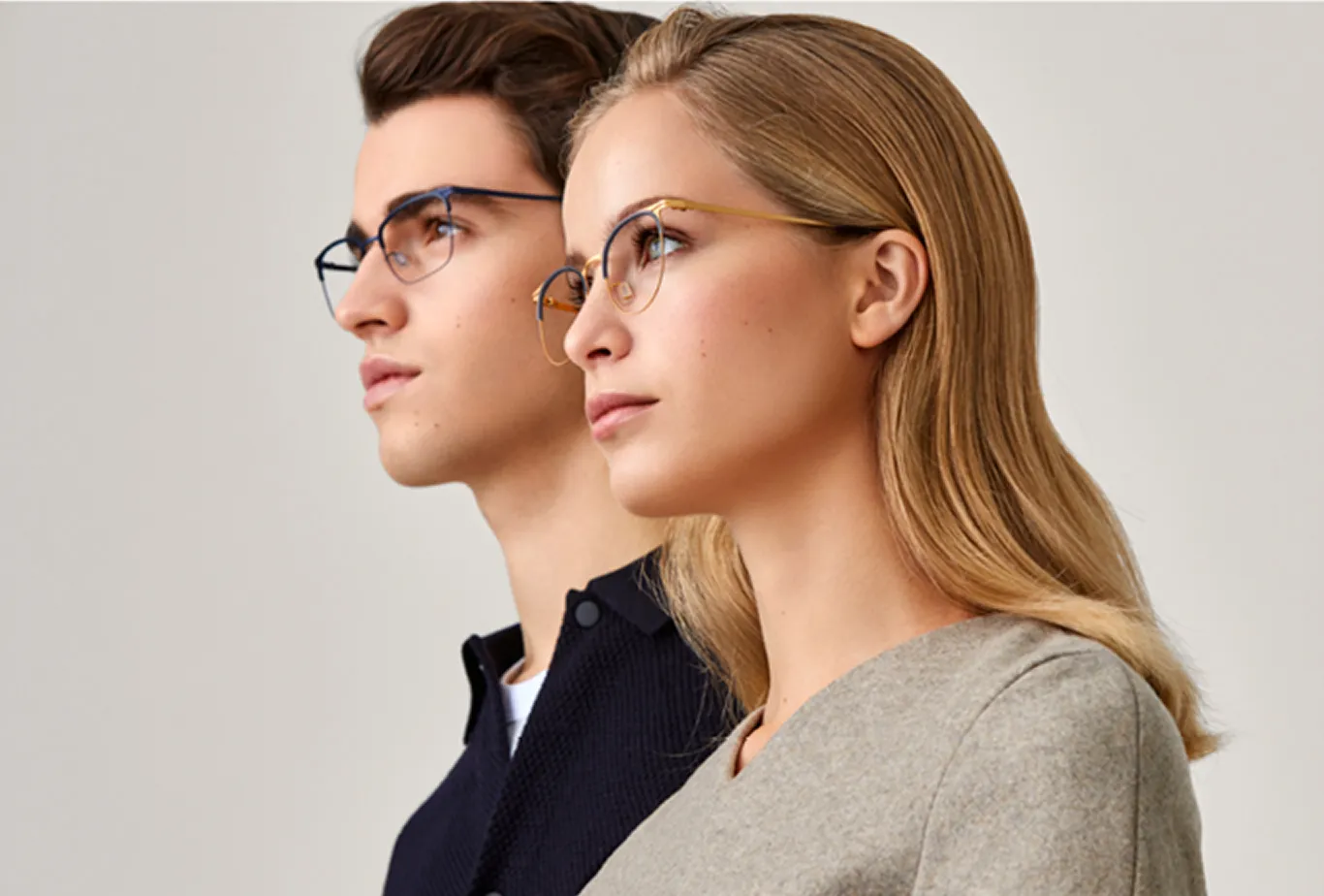 Modo eyewear ad with a man and woman in profile wearing metal glasses