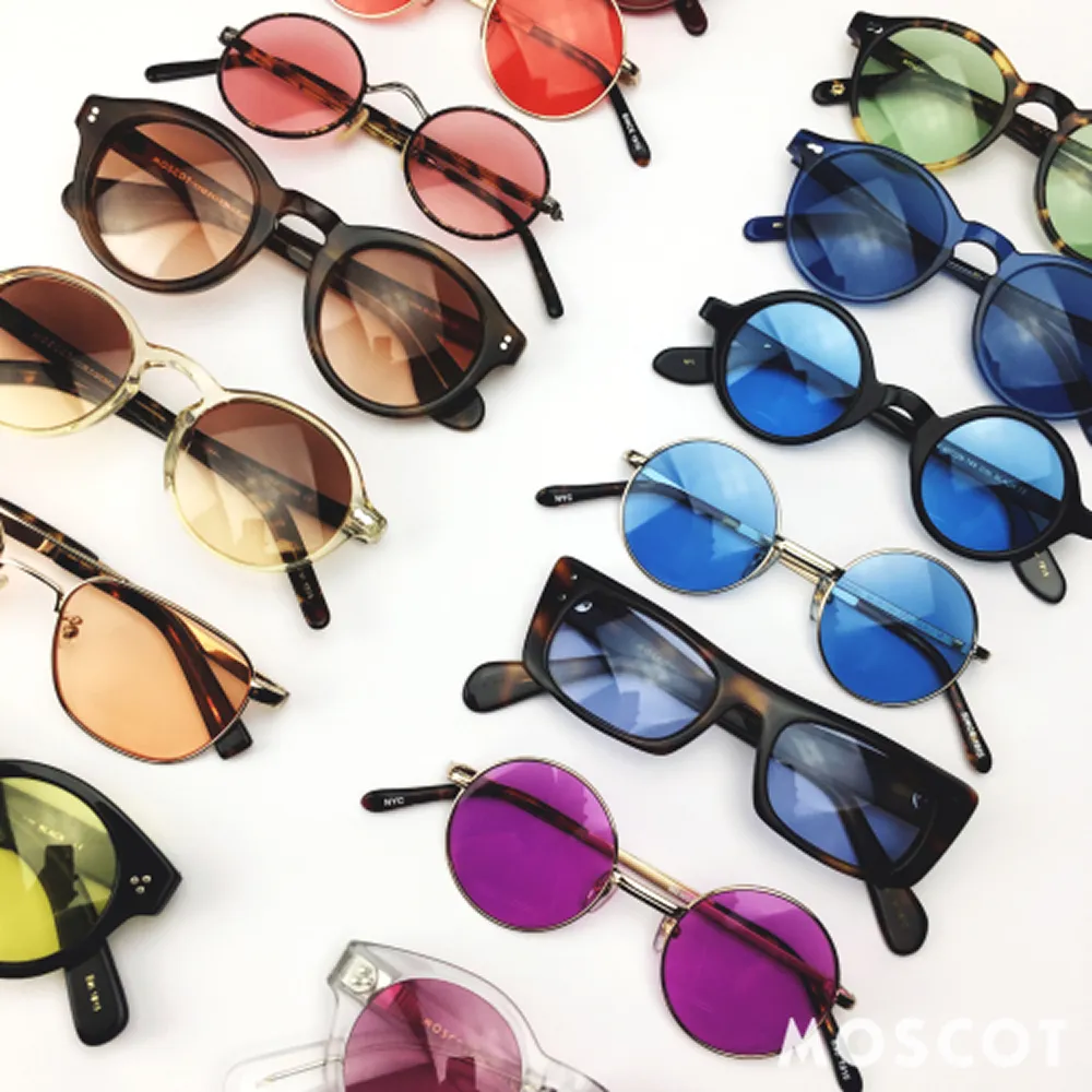 Collection of various colorful sunglasses with round and rectangular frames on a white background.