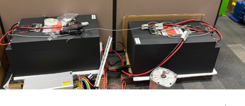 The two LiFePO4 battery packs with BMS wiring and balance leads, as installed on the boat