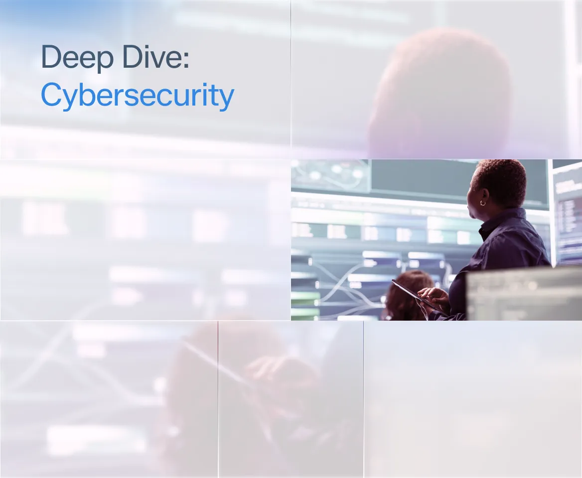 Professional viewing cybersecurity data on multiple monitors in a high-tech control room.