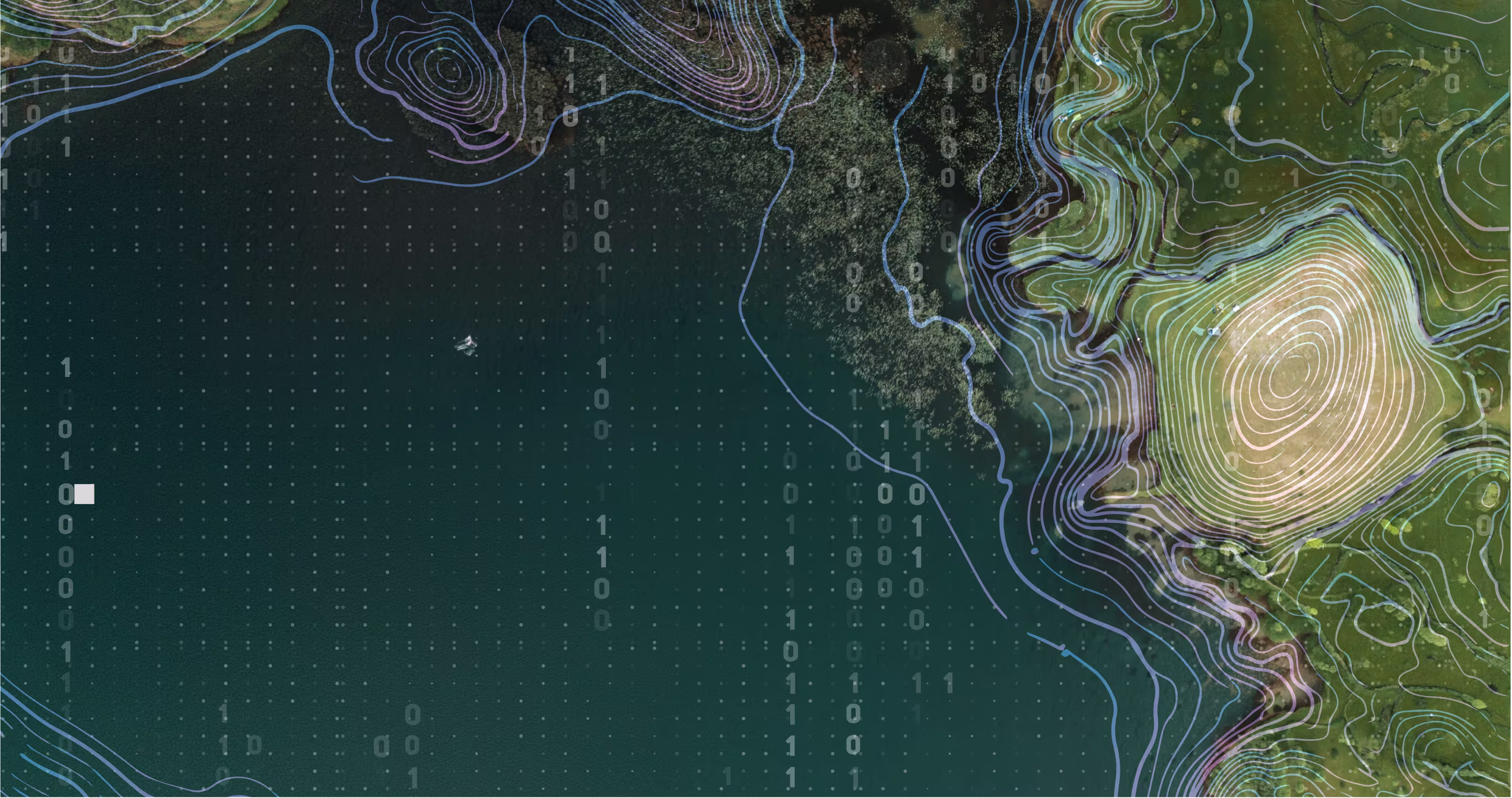 Aerial view of a lake bordered by green land with faint binary code overlay.
