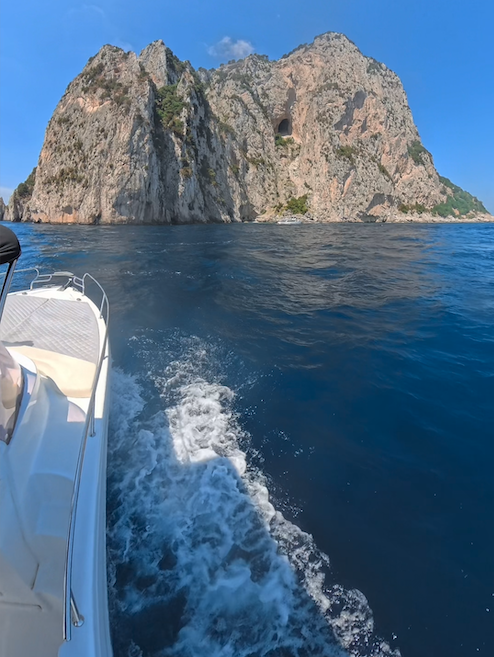 Private boat near the iconic Faraglioni of Capri