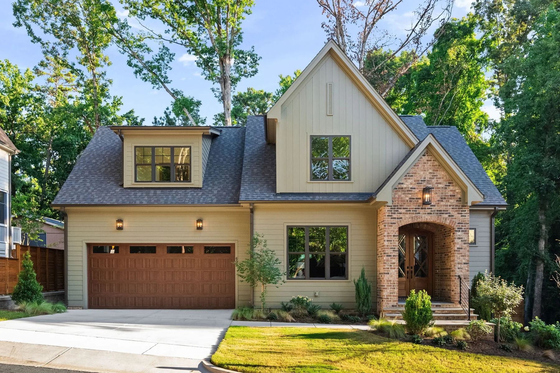 Contemporary two-story home with mixed brick and siding exterior in Cary, North Carolina