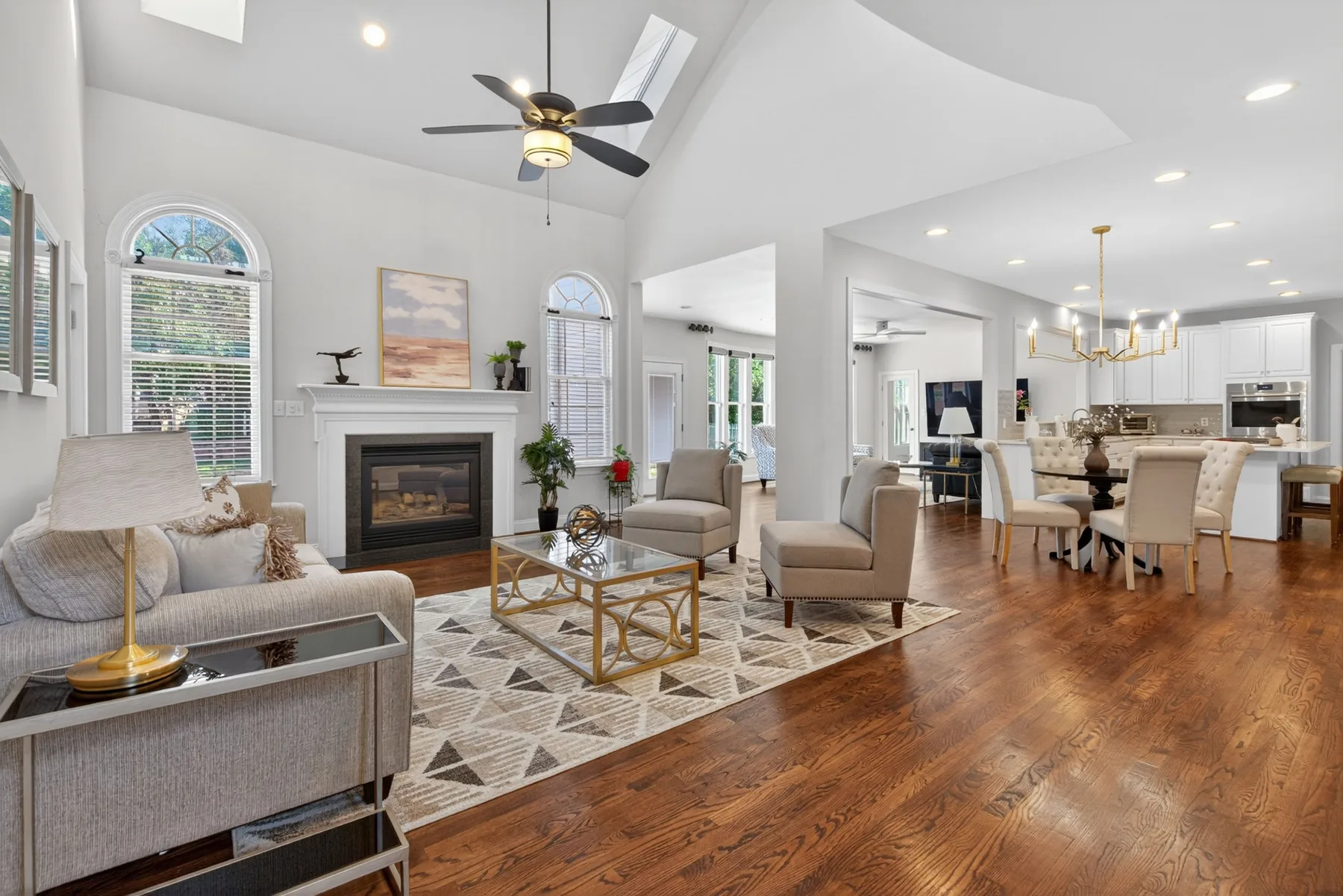 Open-concept living room and kitchen with vaulted ceiling in Cary, North Carolina
