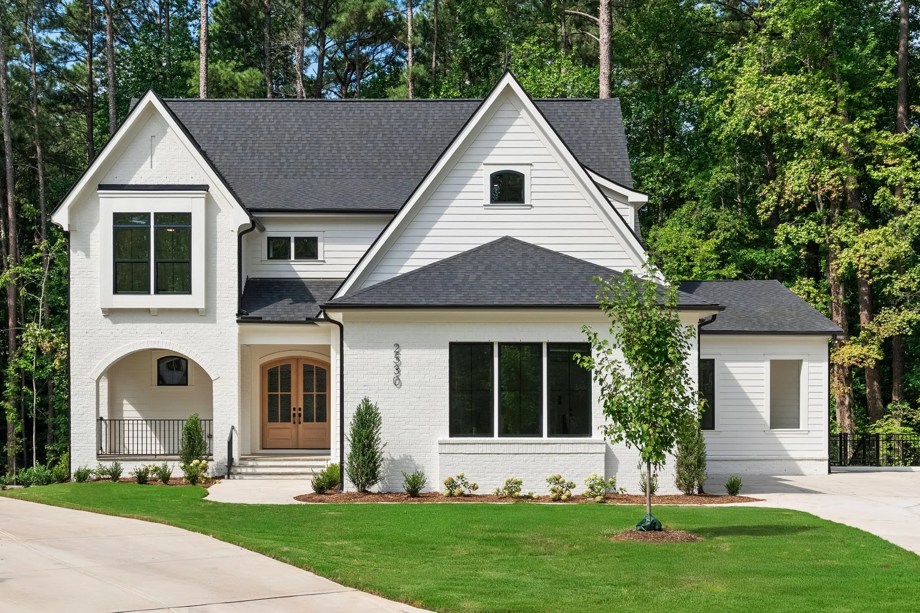 Modern white home exterior photographed in Apex