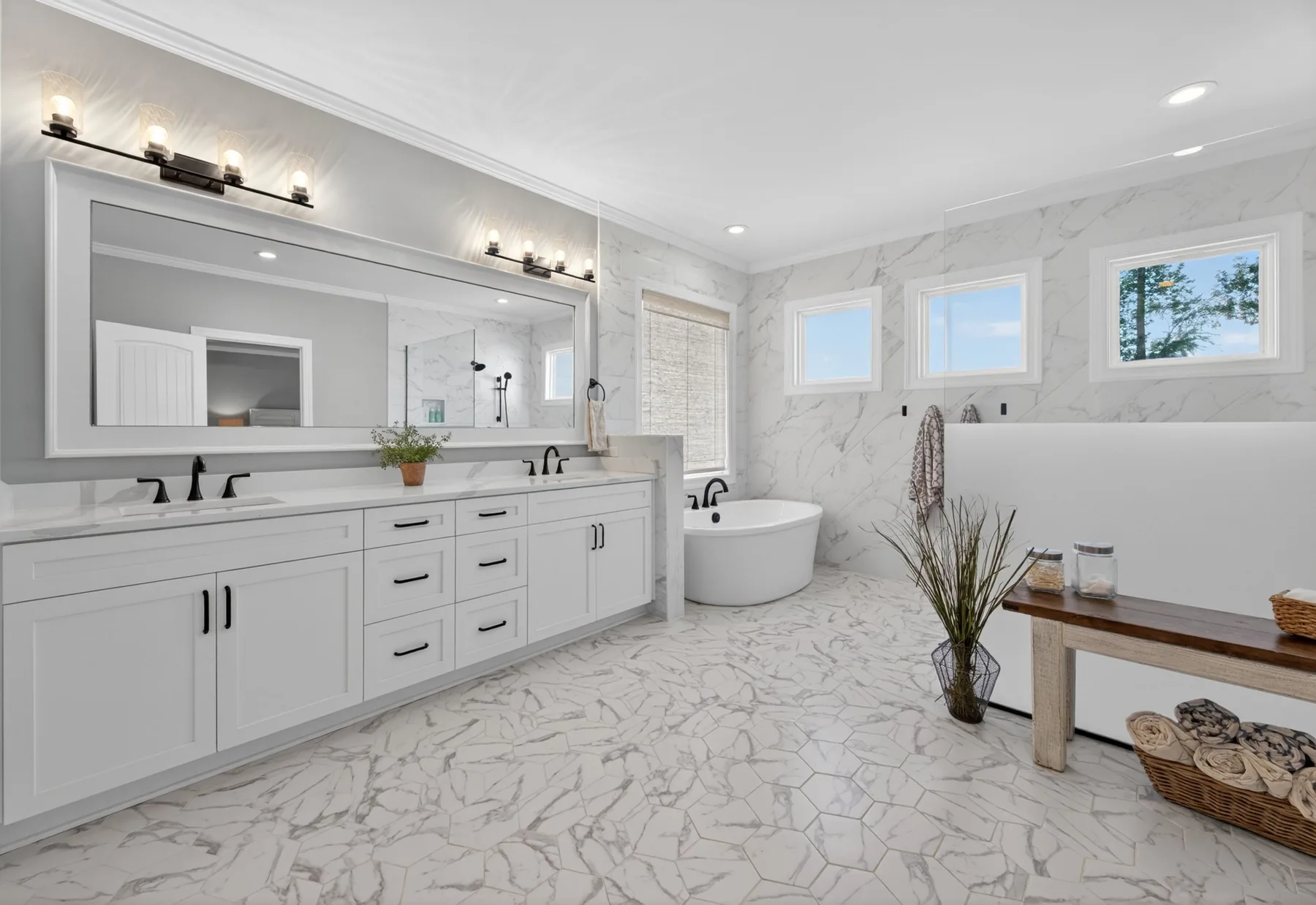 Bright white primary bathroom photographed in a Wake Forest home