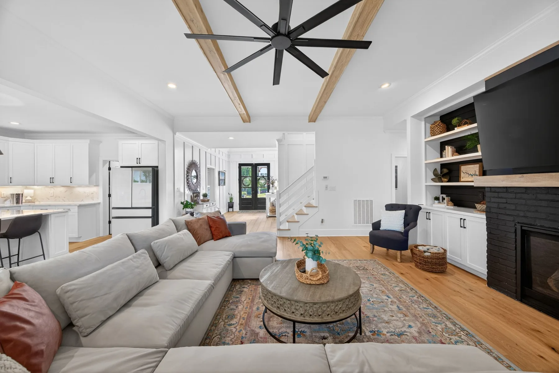 Open-concept living room with fireplace in a Wake Forest home