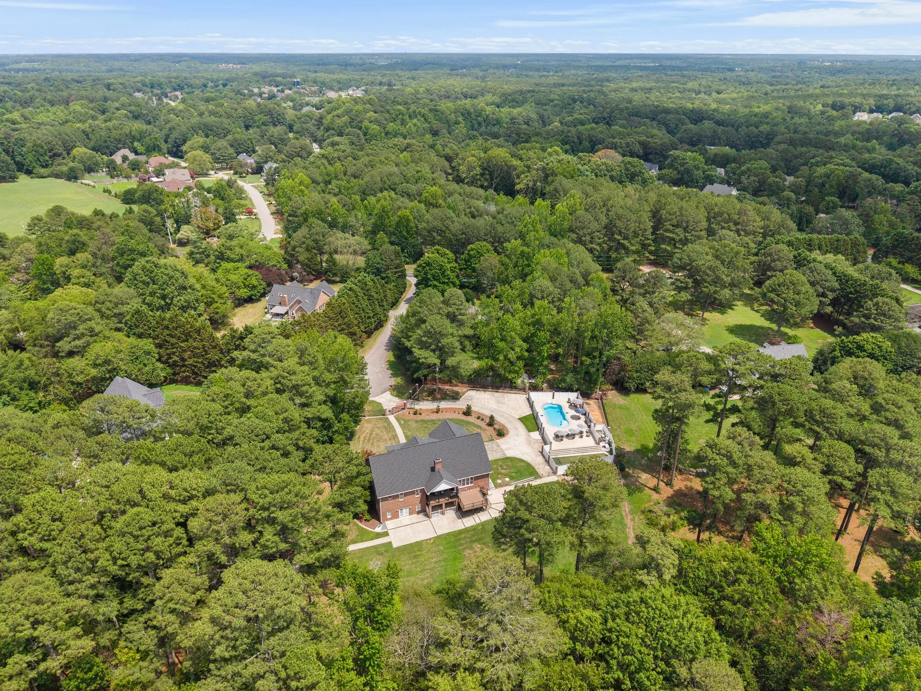Aerial view of a wooded residential property in Wake Forest, North Carolina