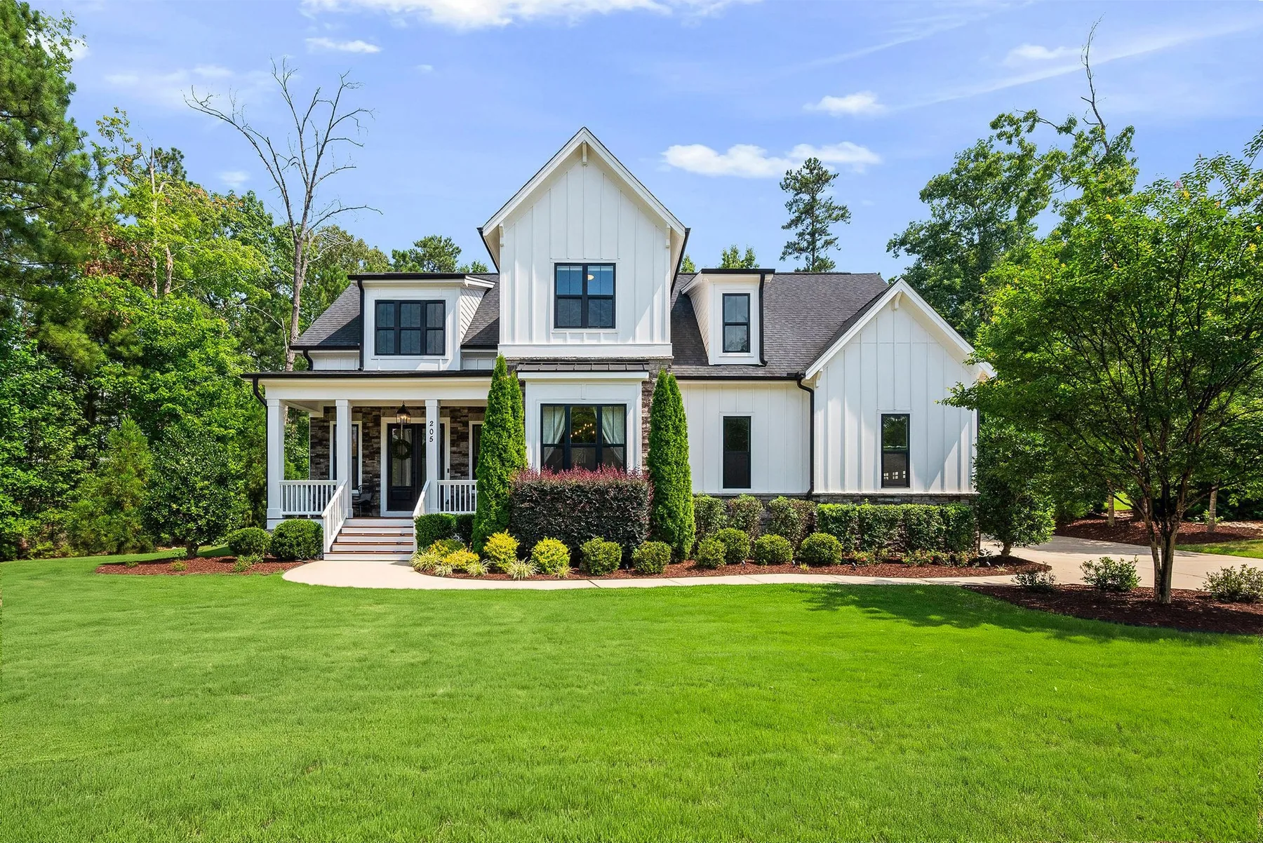 White modern farmhouse exterior photographed in Holly Springs, North Carolina