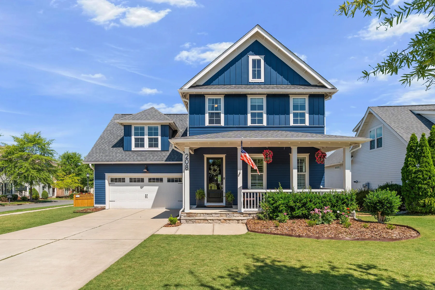 Blue two-story home exterior photographed in Holly Springs, North Carolina
