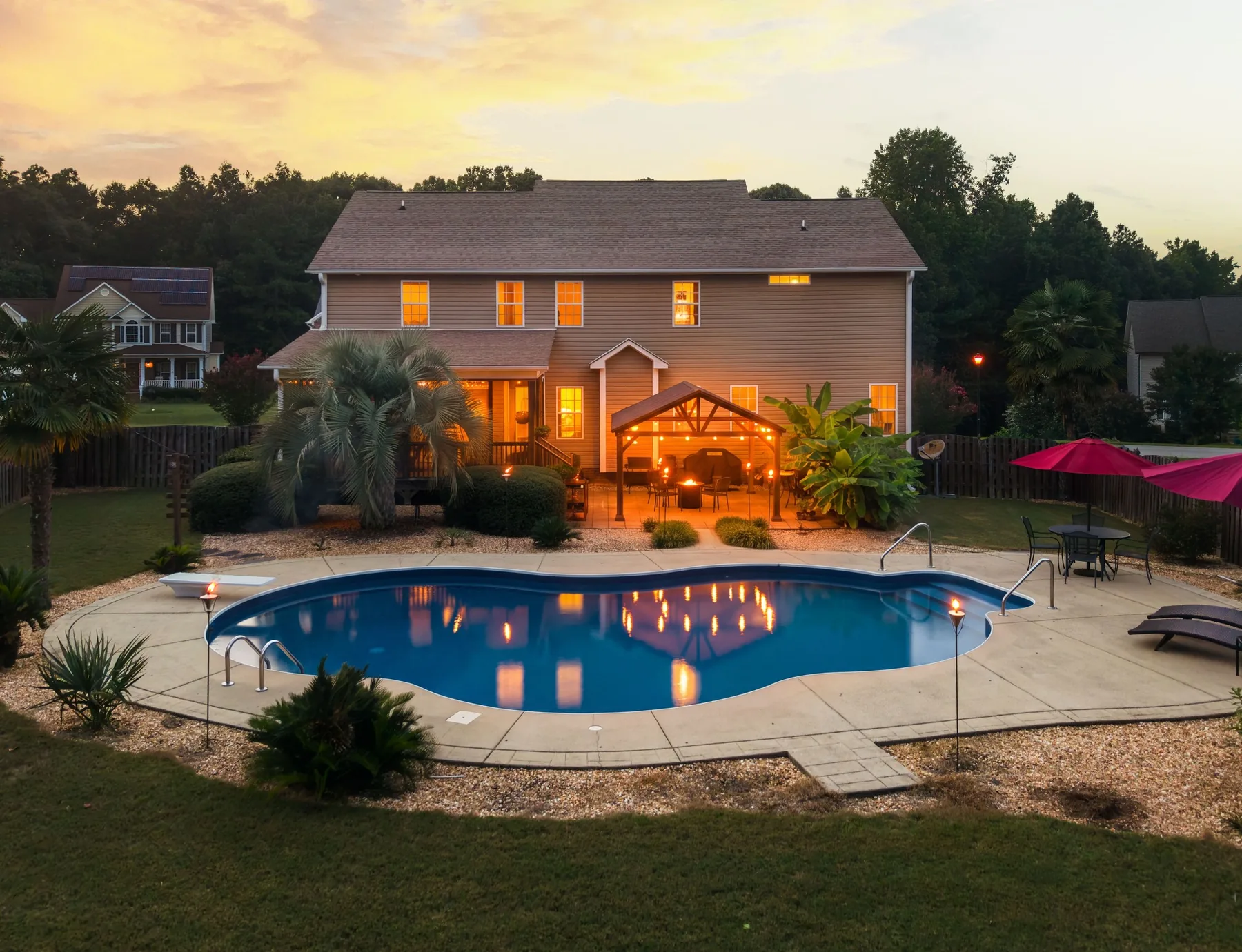 Backyard swimming pool at twilight photographed in Clayton, North Carolina